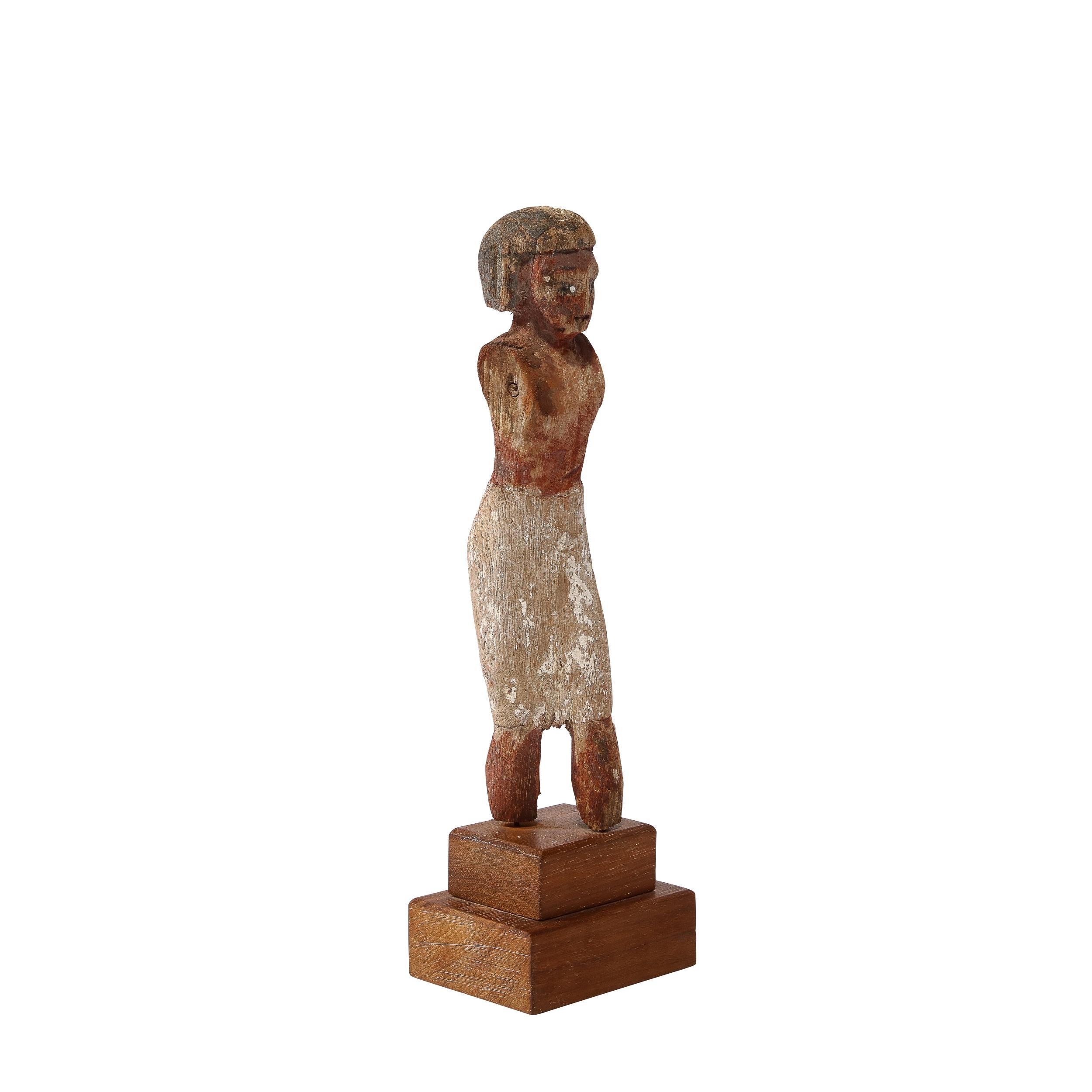 Oarsman carved of wood, originally primed with stucco and painted. This figure formed part of the crew who, some seated, some standing, manned the so-called 