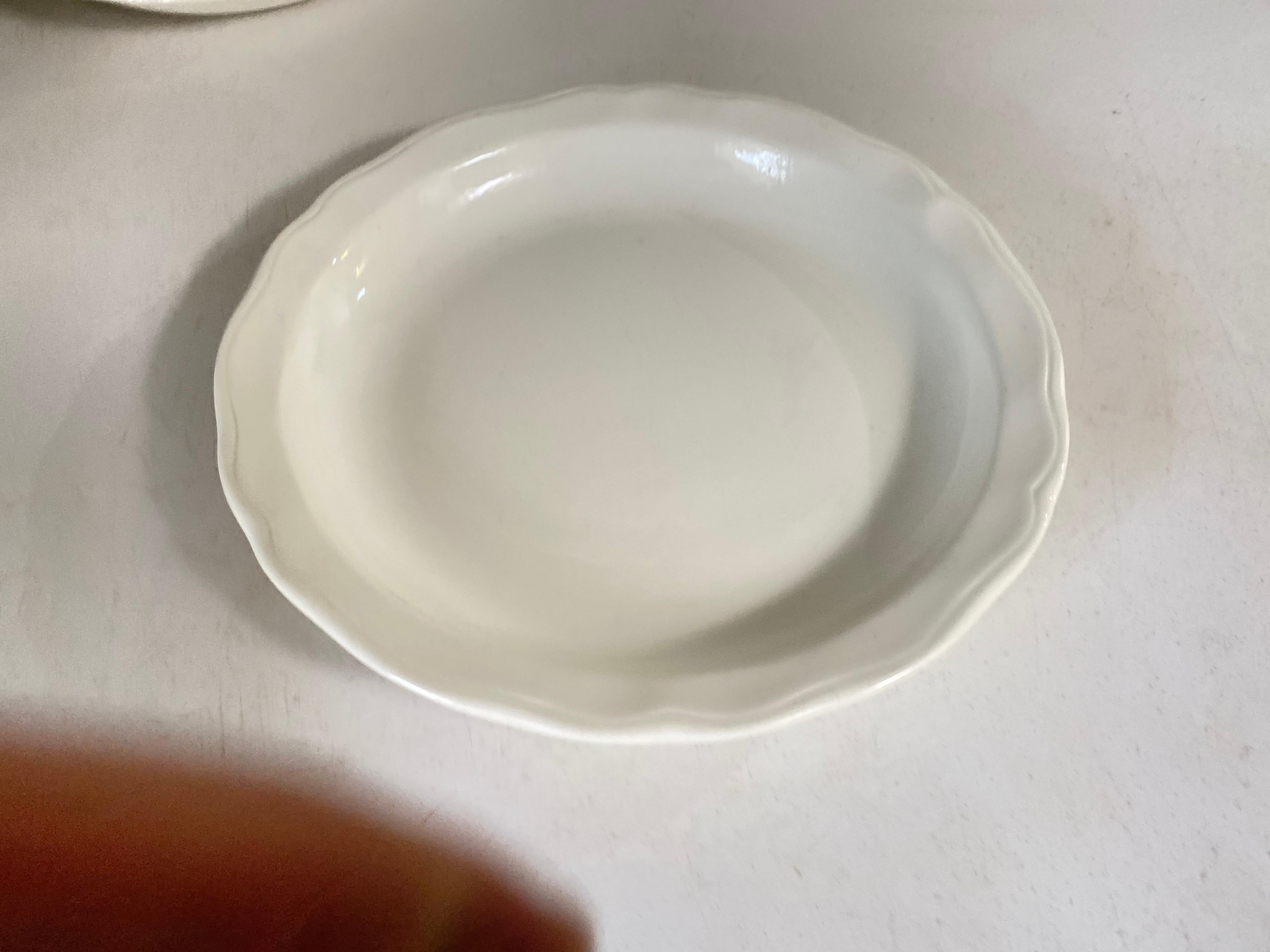 The set of Enameled Glaze large plates, is from Luneville.
The model is 