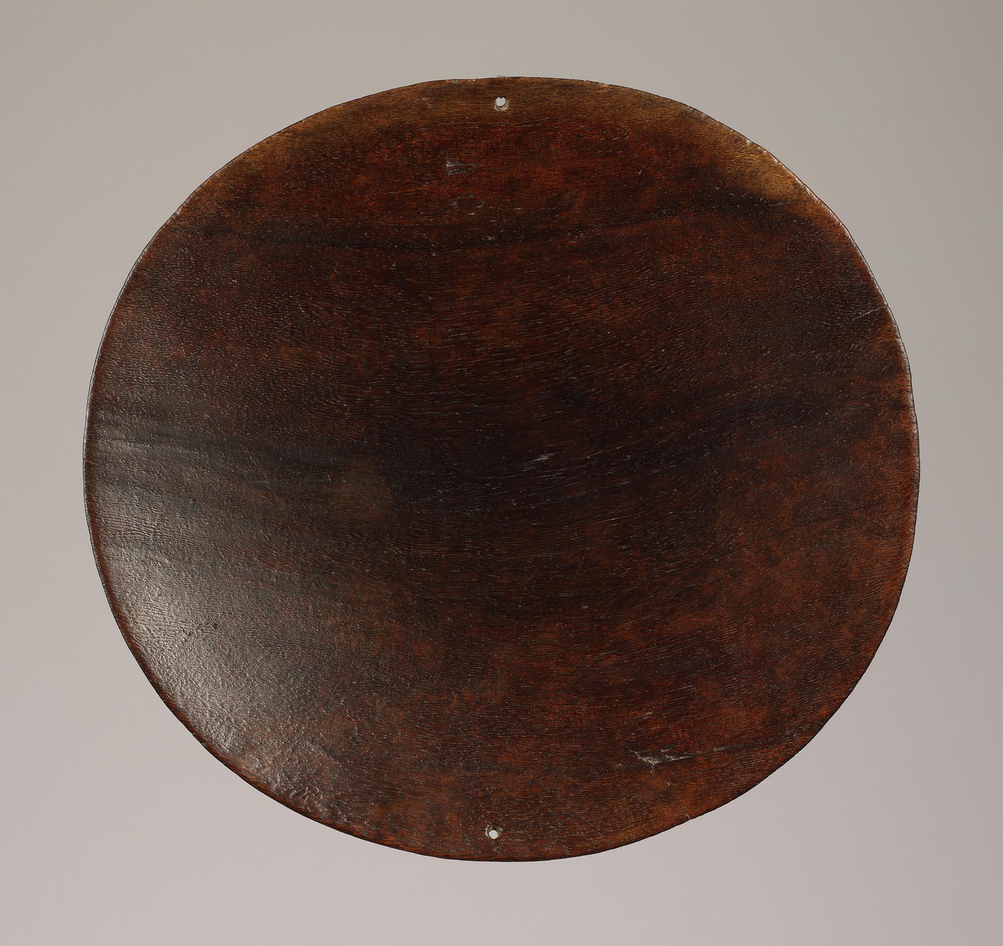Ancient Fiji Islands Flat Serving Bowl or Platter 19th century, made of very dense hardwood with deep patina, and expected wear on bottom.  Two small opposing holes for suspension.
Bowl is 14 1/4