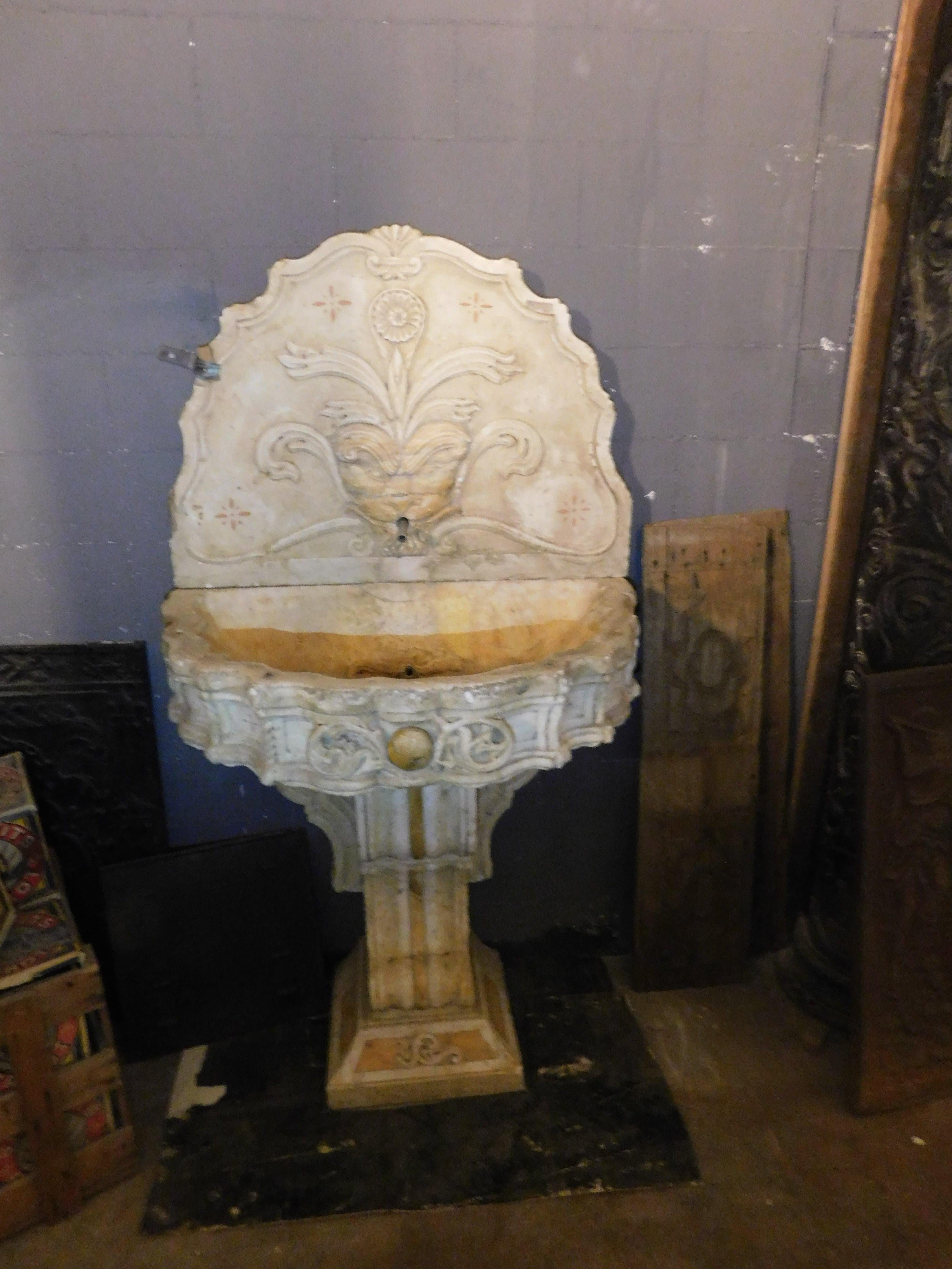 Antiques fountain in white marble, richly carved and inlaid with 