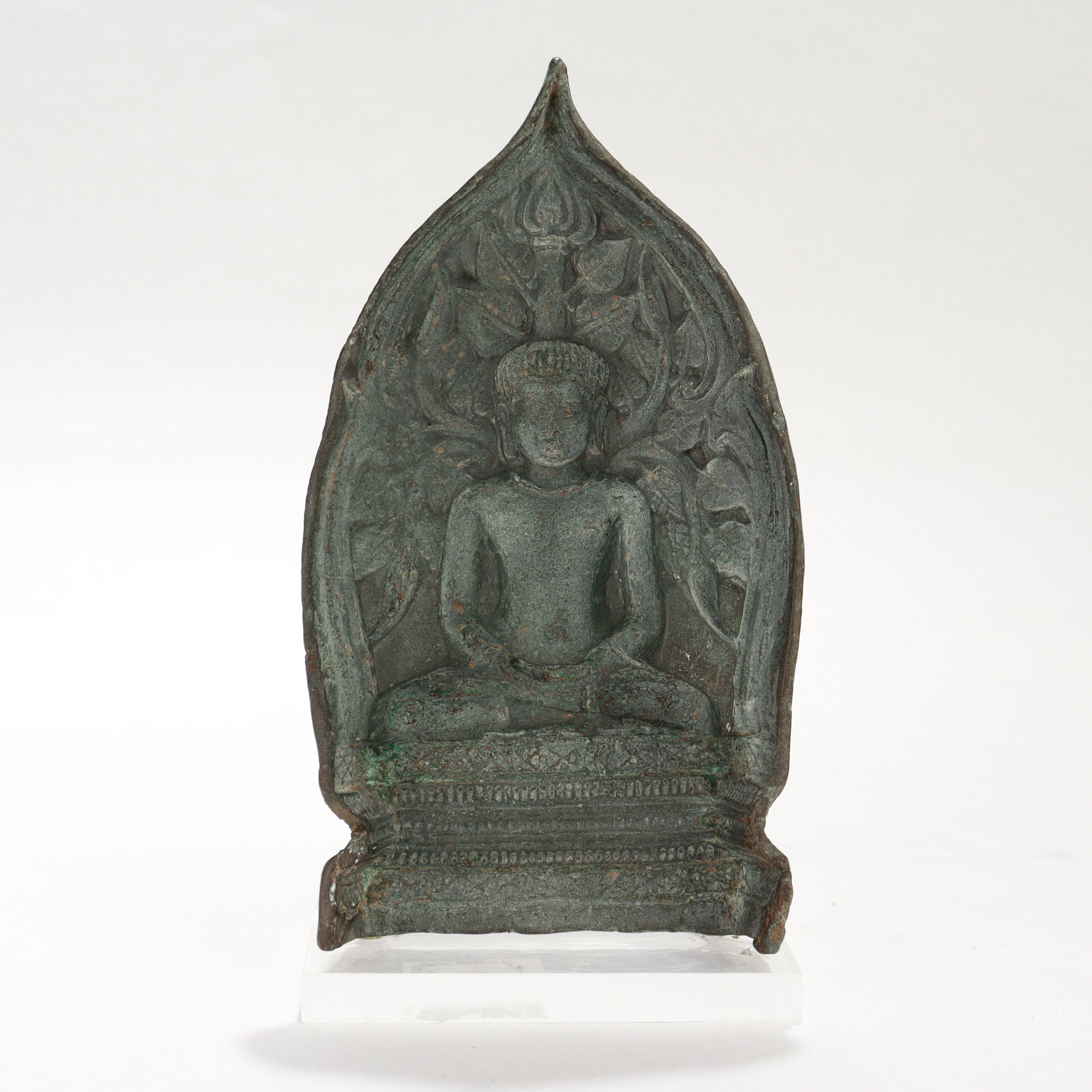 A fine ancient Gandharan Tsa Tsa mold.

In the form of the Buddha seated in meditation.

With a handle to the base of the front.

With verdigris throughout and mounted on a rectangular lucite plinth.

Simply a wonderful ancient mold!

Date: 
ca. 1st
