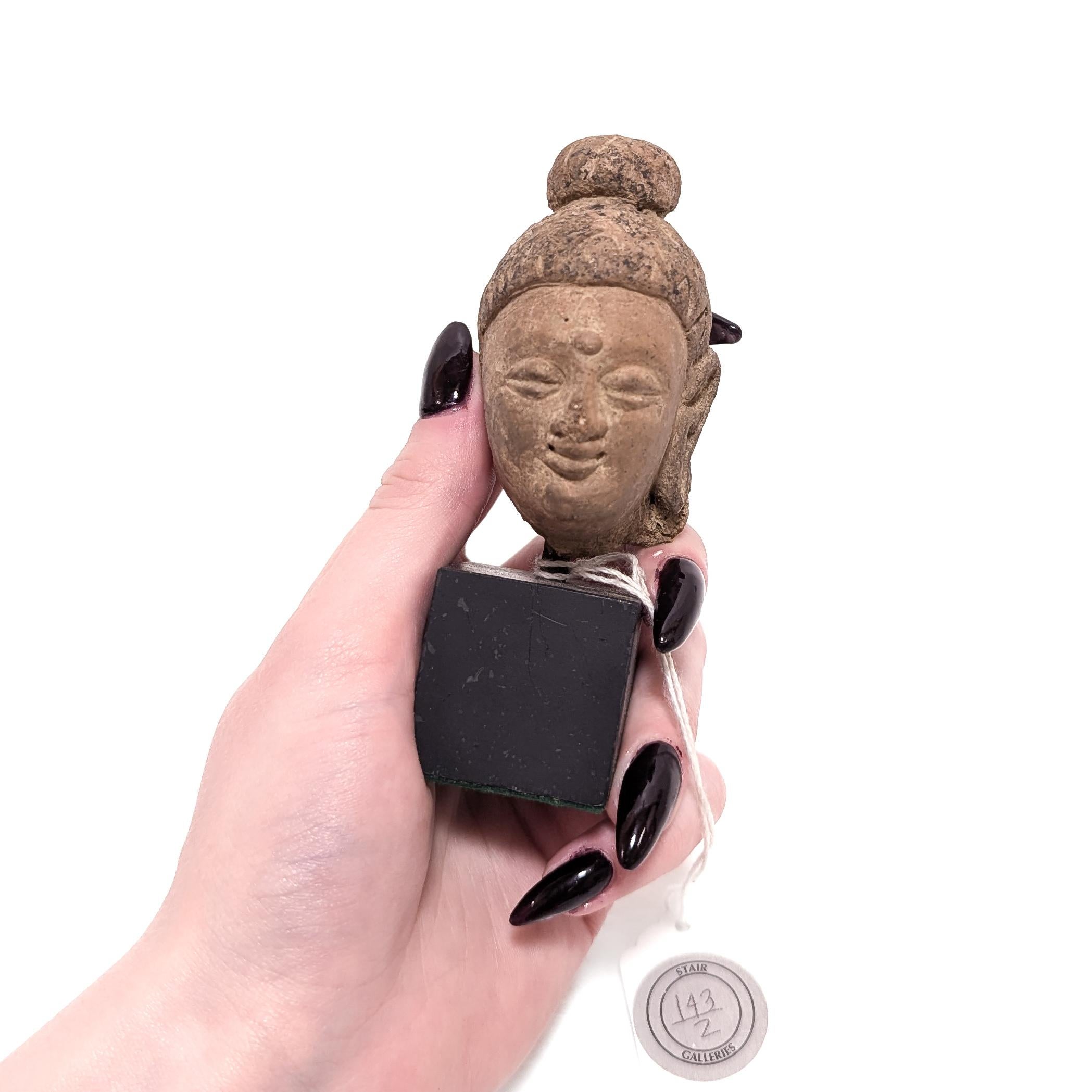 A fine ancient stucco bust on a plinth.

In the form of the Buddha, Siddhartha Gautama.

Mounted on a black wooden plinth.

Retaining an old Stair Galleries auction label and collection stickers to the reverse.

Simply a wonderful miniature
