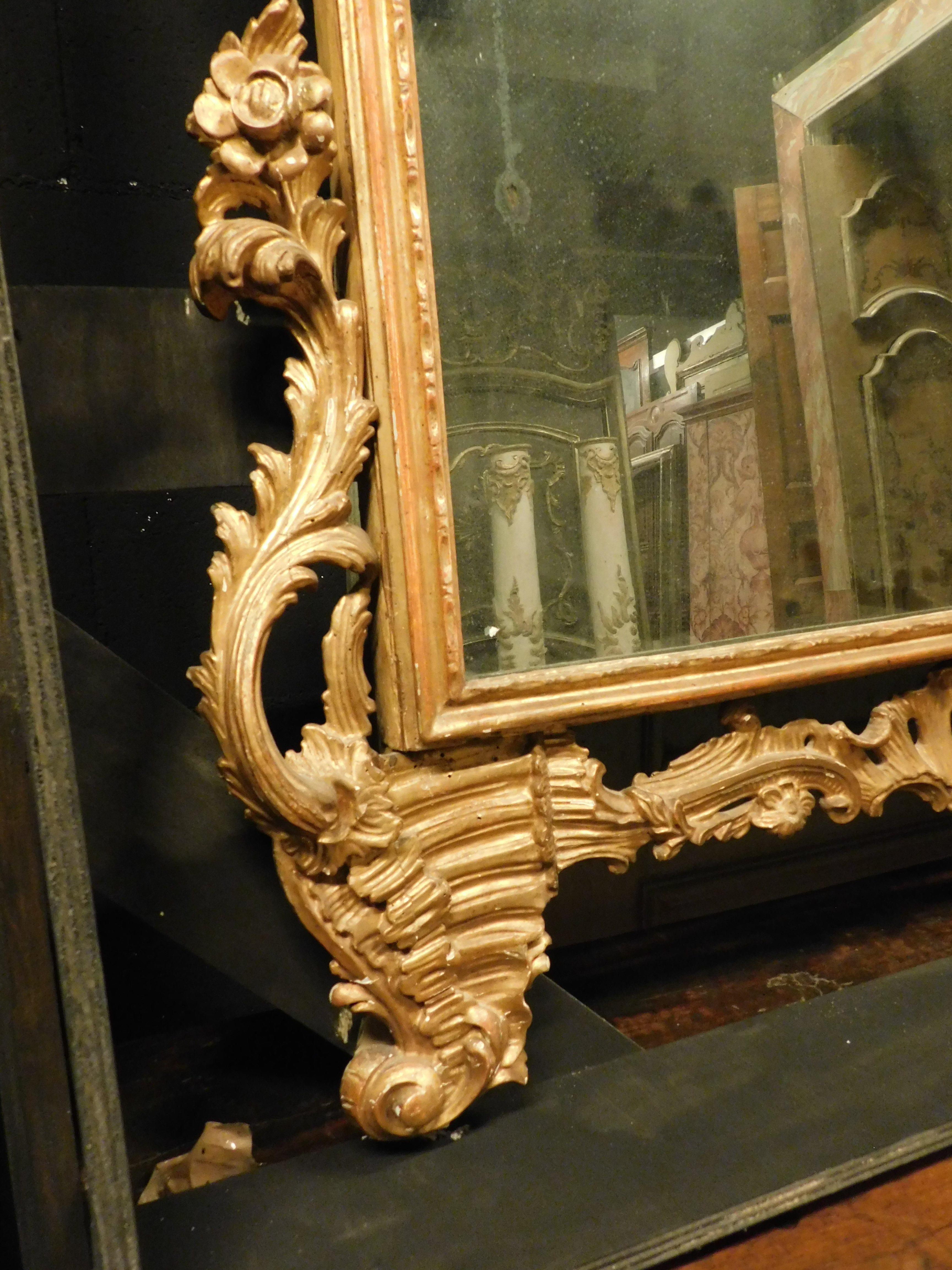 Mirror Ancient gilded wooden mirror with richly carved cymatium, Italy For Sale