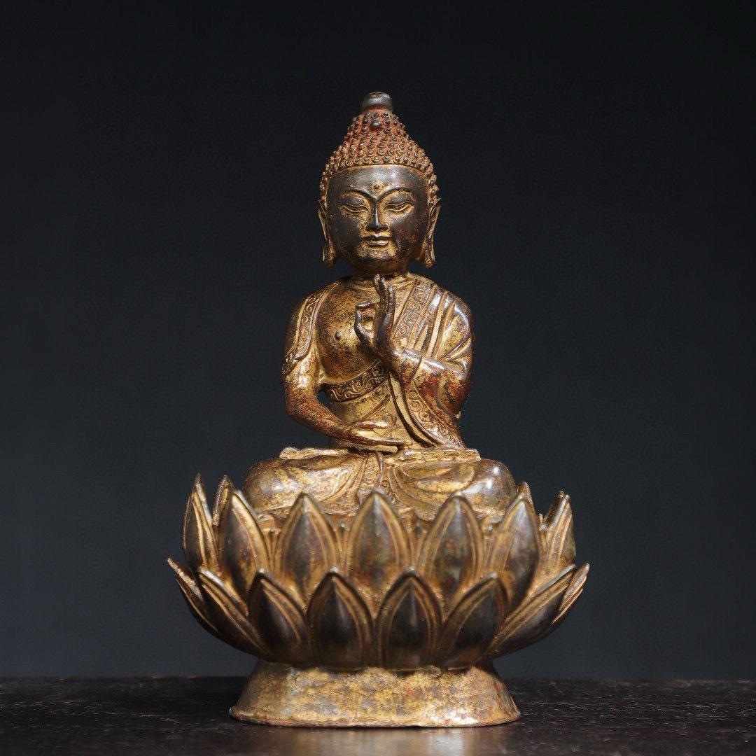 This Ancient Gilt Bronze Sitting on Lotus Buddha Statue is very special and beautiful, Buddha seated in a meditation posture atop a lotus flower.

The Buddha sitting on a lotus flower holds great symbolic significance in Buddhism. The lotus