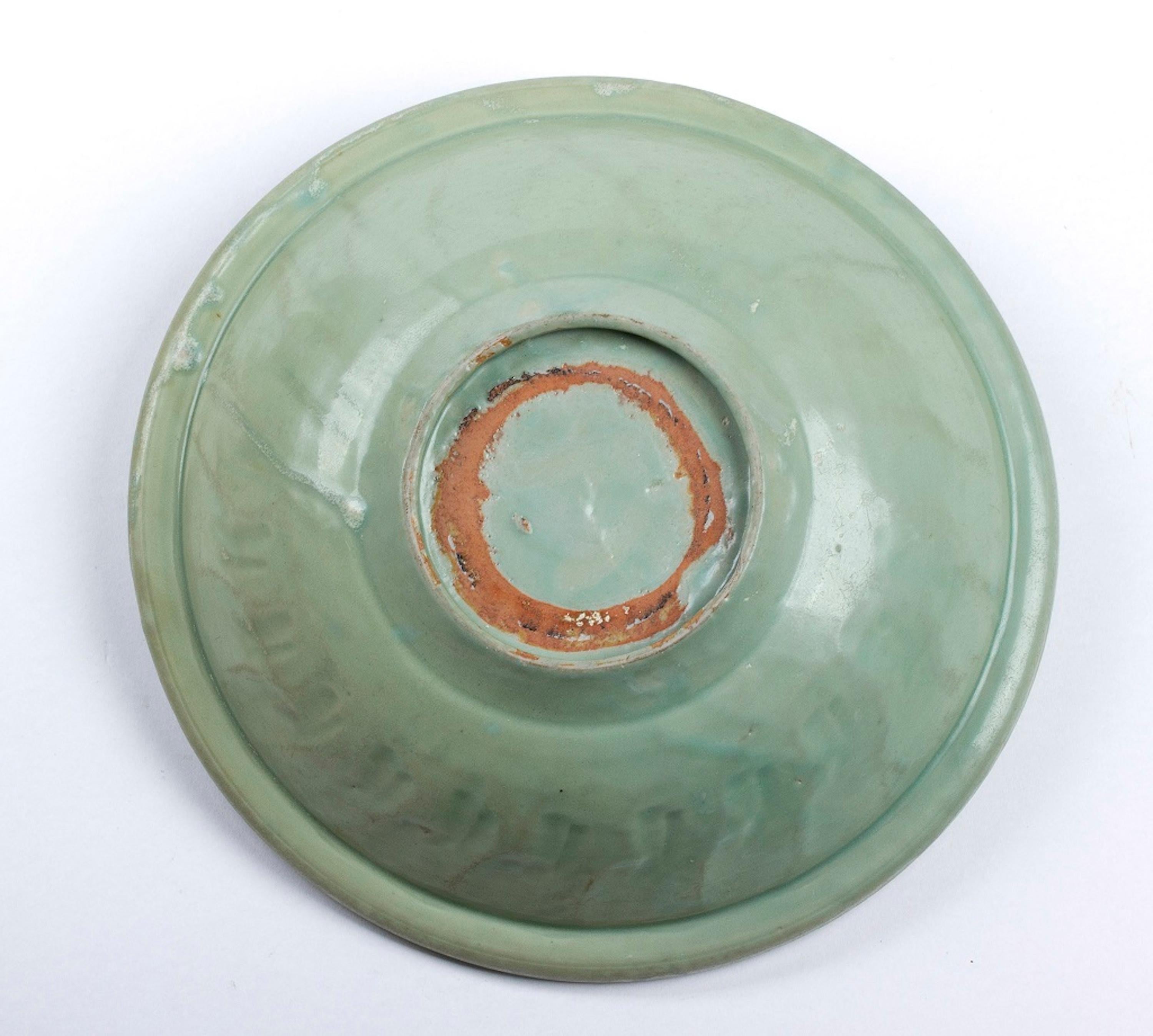 Glazed ceramic dish is an original artwork realized in China during the Ming dynasty.

Longquan Céladon glazed ceramics. 

Provenance: Private collection. 

Good conditions. 

The object is an original Longquan Céladon ceramic production.