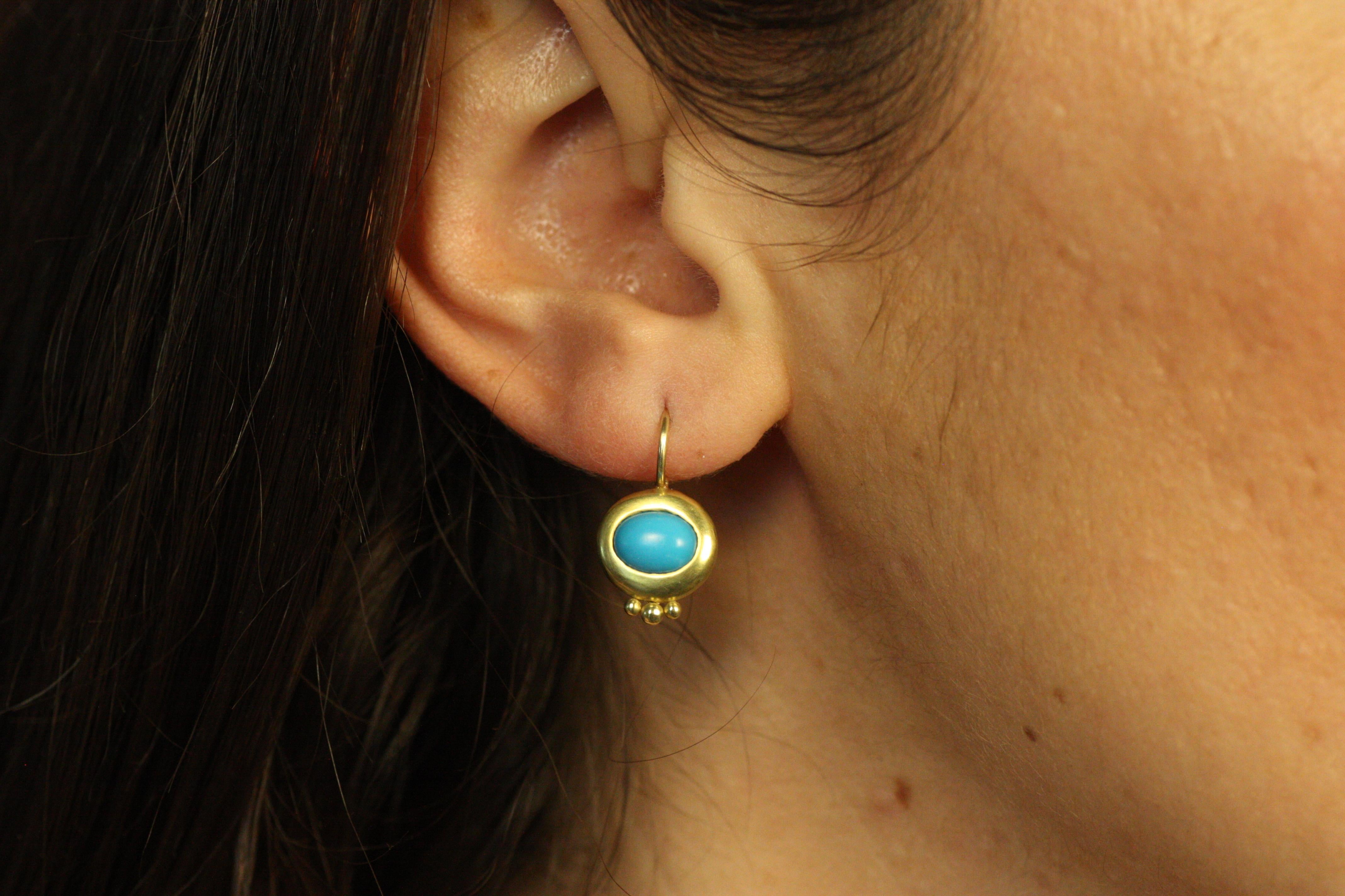 Bright and bold, these Greco Earrings feature vibrant turquoise gemstones set in 20K California gold. The bezel-set turquoise stands out against the warmth of the gold, making these earrings a standout piece. The earrings are finished with three