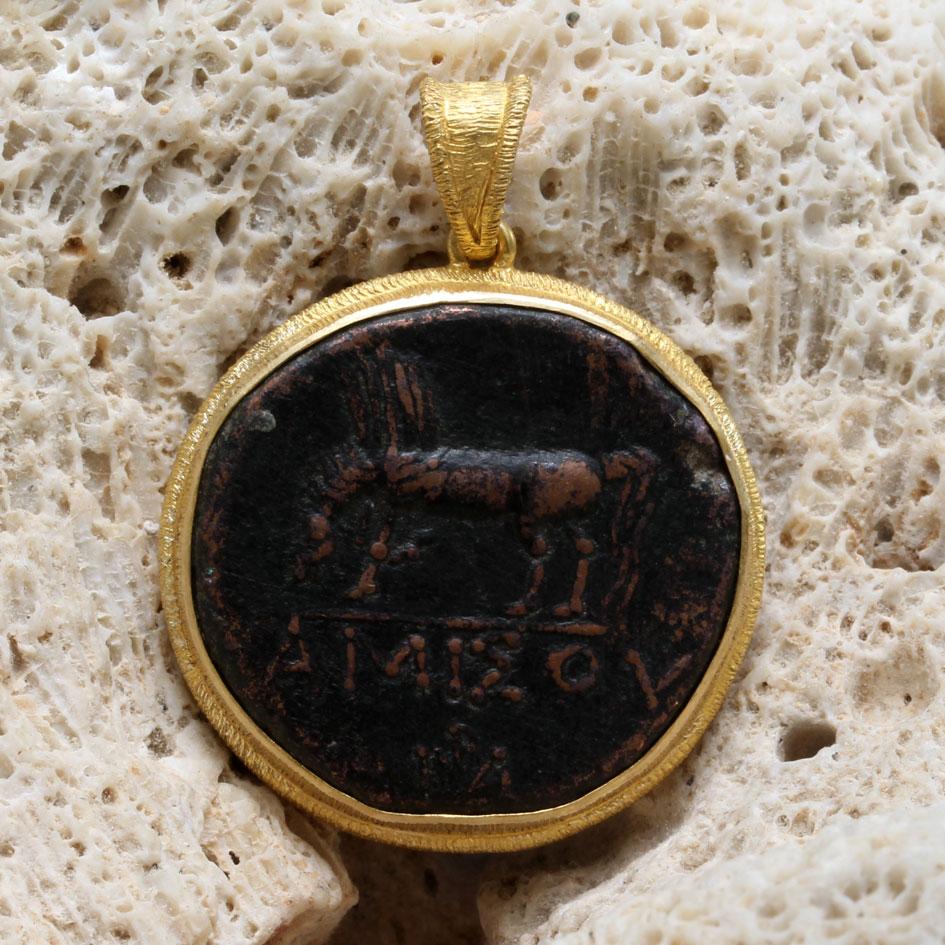 An authentic large bronze coin depicting Pegasus drinking, with Greek letters AMISOS below was struck between 85-65 BC in the ancient Greek region of Pontos, Amisos which is now on the northern coast of Turkey bordering the Black Sea.  Amisos was a