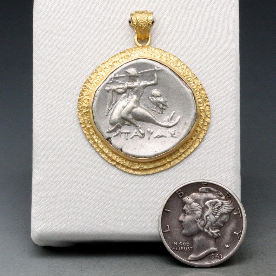 coin with dolphin