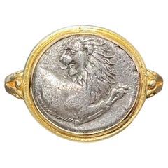 Antigua moneda griega de león del siglo IV a.C. Anillo de oro de 18 quilates