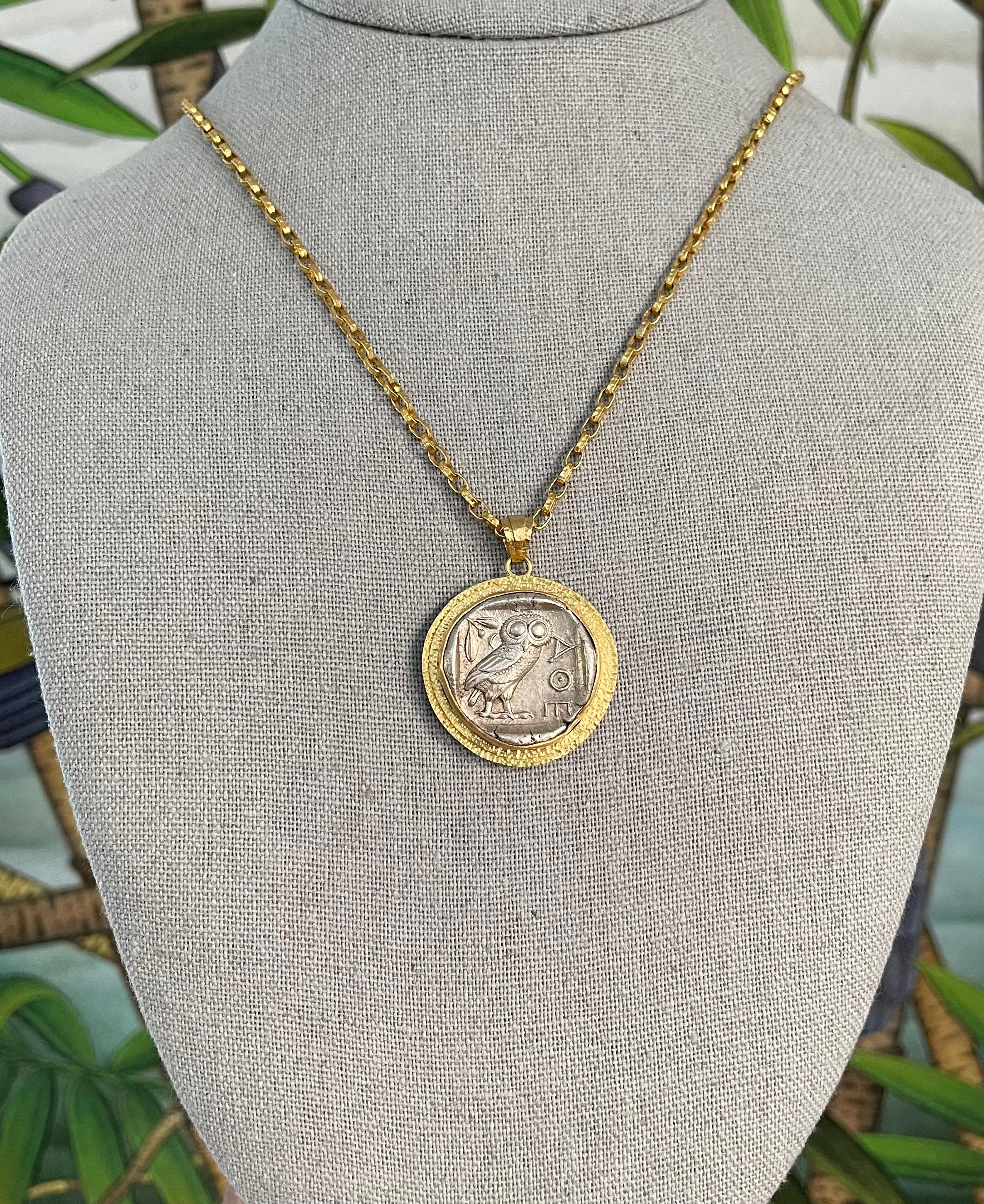 An authentic silver Ancient Greek Athenian owl coin from 475-425 BC is held in a hand textured double hammered bezel signature Steven Battelle 18K gold pendant design. This TOP-GRADE iconic coin from Athens, Attica, is a tetradrachm (4 drachms)