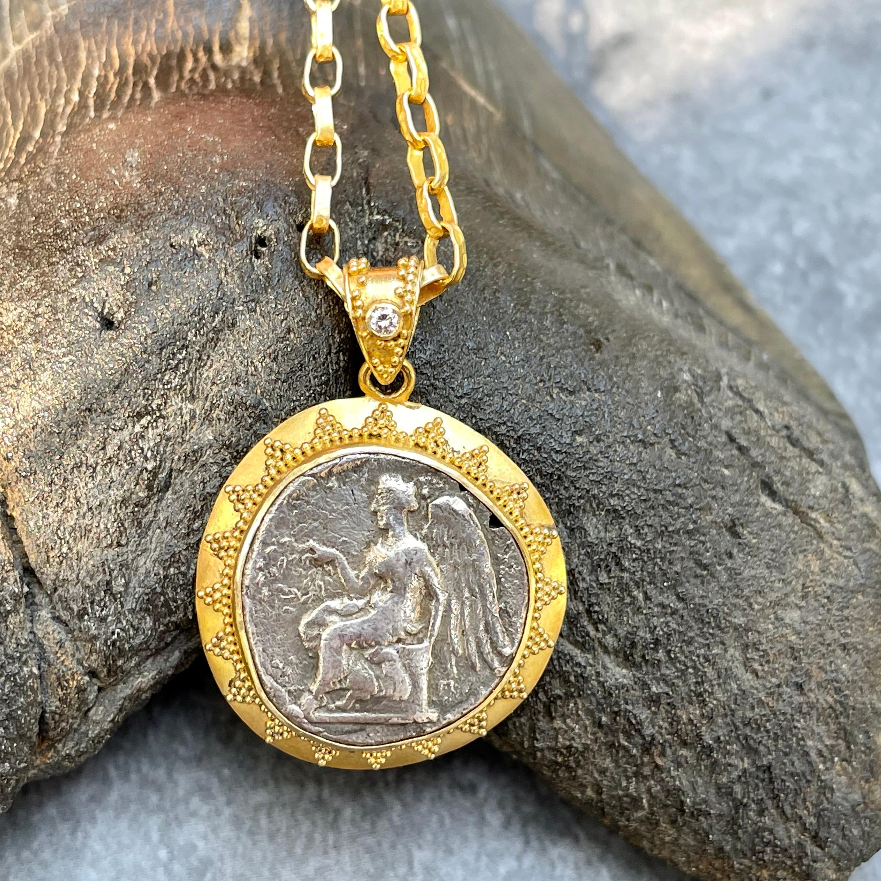 An authentic and rare ancient Greek coin from the Greek colony of Terina in Bruttium (now near the town of Lamezia Terme on the west coast of southern Italy) is set in fine geometric 22K gold granulation in this ancient-inspired Steven Battelle