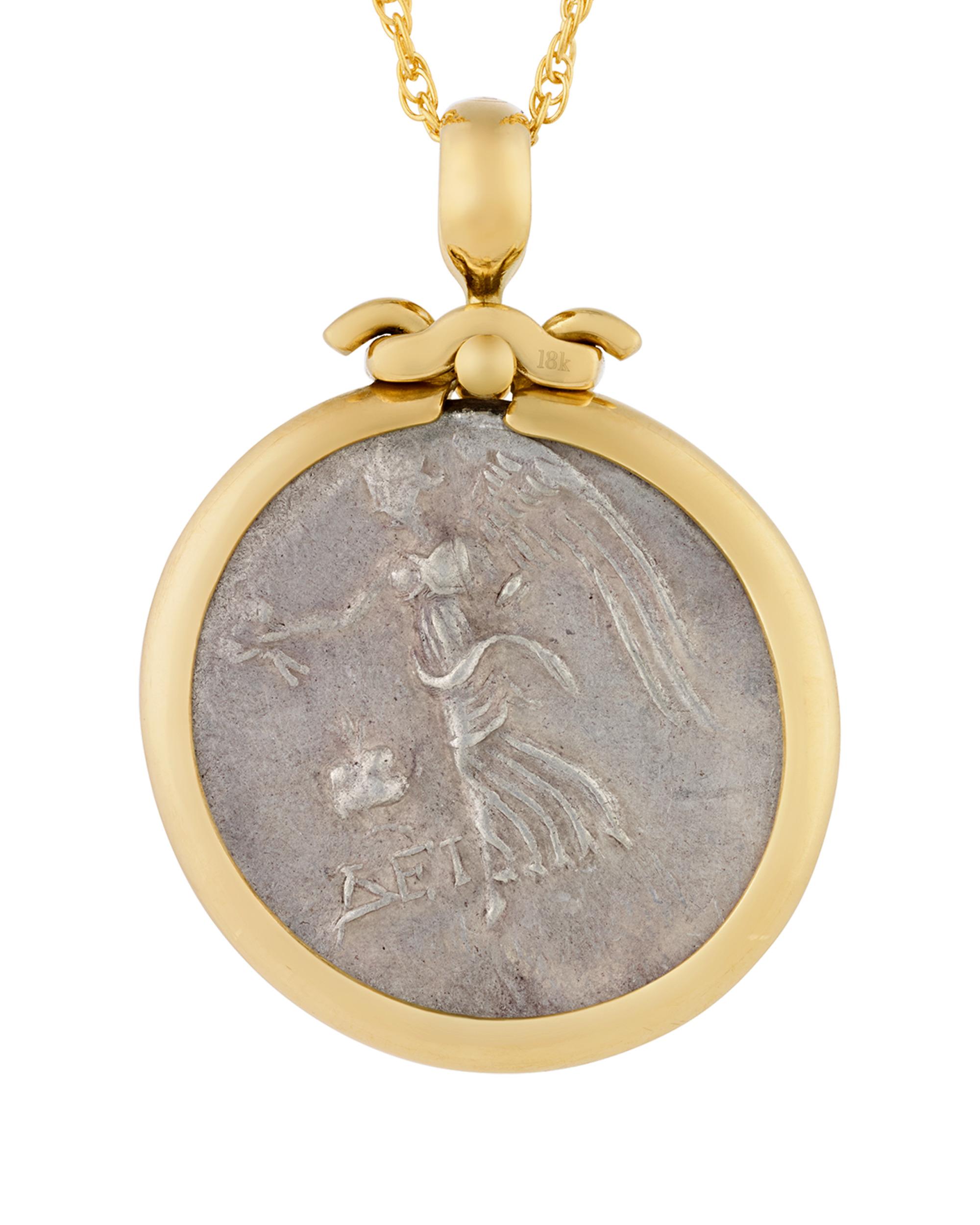 The ancient Greek coin set in this elegant necklace dates to the 2nd century BCE and celebrates Athena, one of the most important Greek goddesses and patroness of wisdom and war. The deity, with her iconic crested Corinthian helmet, is featured