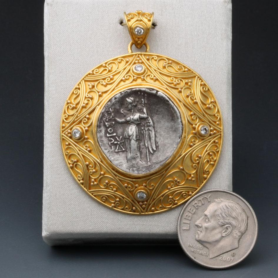 An authentic silver drachm coin from Boeotia in ancient Greece, Federal Coinage, 225-171 BC,  is set in delicate filigree and granulation with five 1.8 mm VS1 diamonds in this Steven Battelle designed 22K gold setting.  This pendant is demonstrative