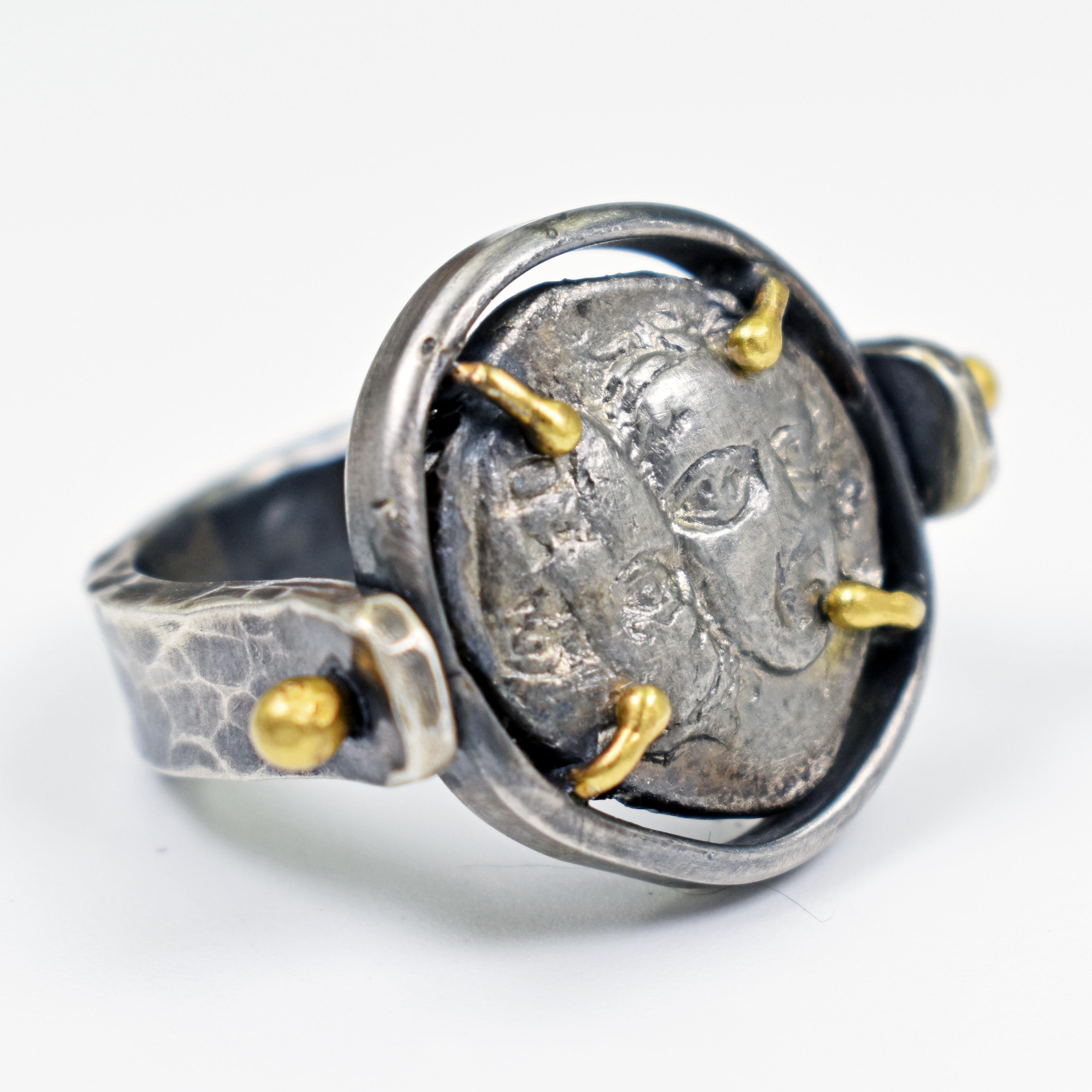 Authentic ancient Greek silver coin (Thrace, Istros, 400 - 350 BC) set in a hammered, oxidized sterling silver hand-forged flip ring with 22k yellow gold accent prongs. Size 7. Greek coin is approximately 0.69 inches (17.5 mm) long and 0.63 inches