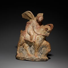 Ancient Greek Eros riding a goat in terracotta