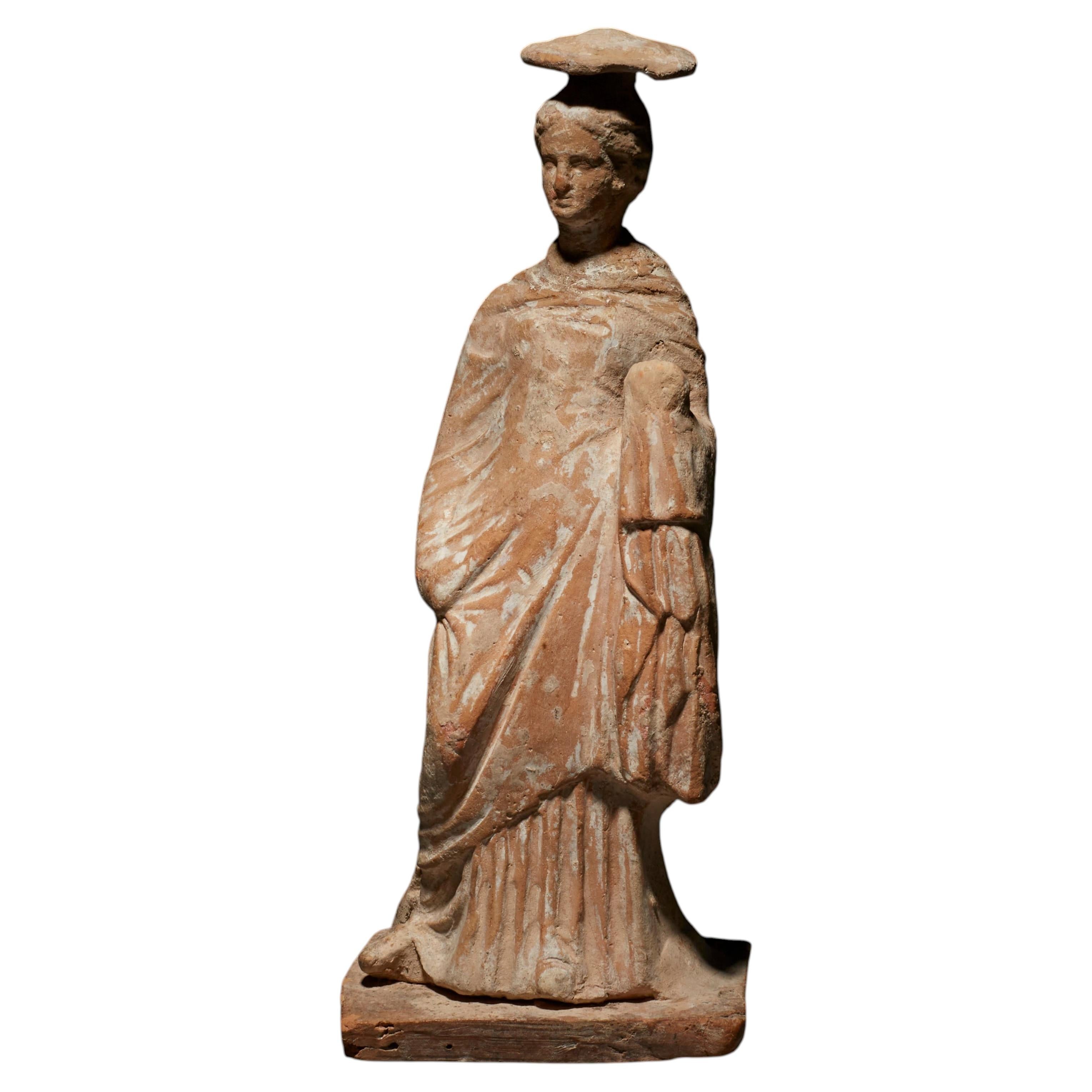 Ancient Greek Female sculpture in terracotta