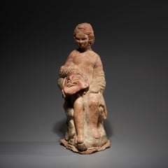 Ancient Greek Figure of an actor with a theater mask in terracotta