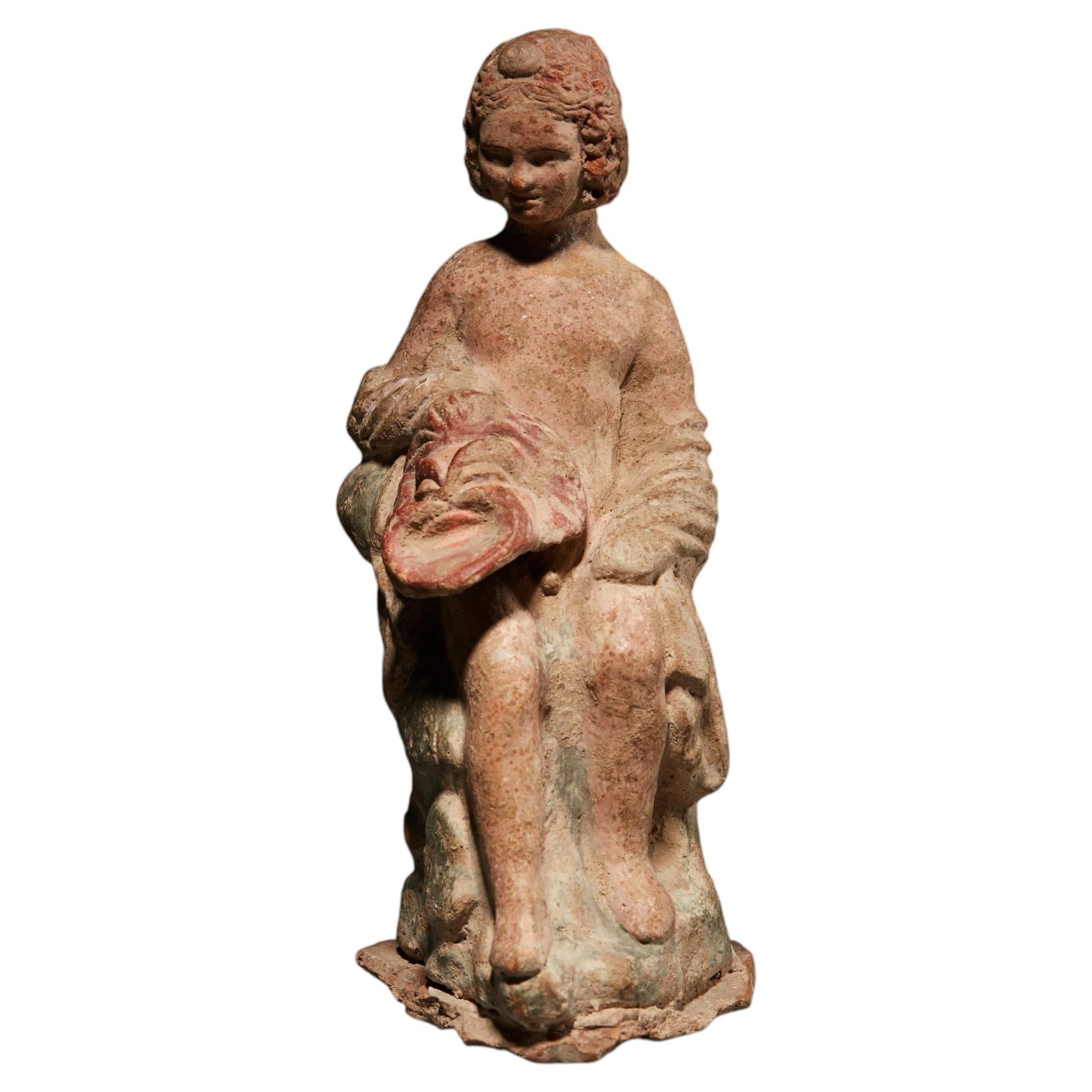 Ancient Greek Figure of an actor with a theater mask in terracotta