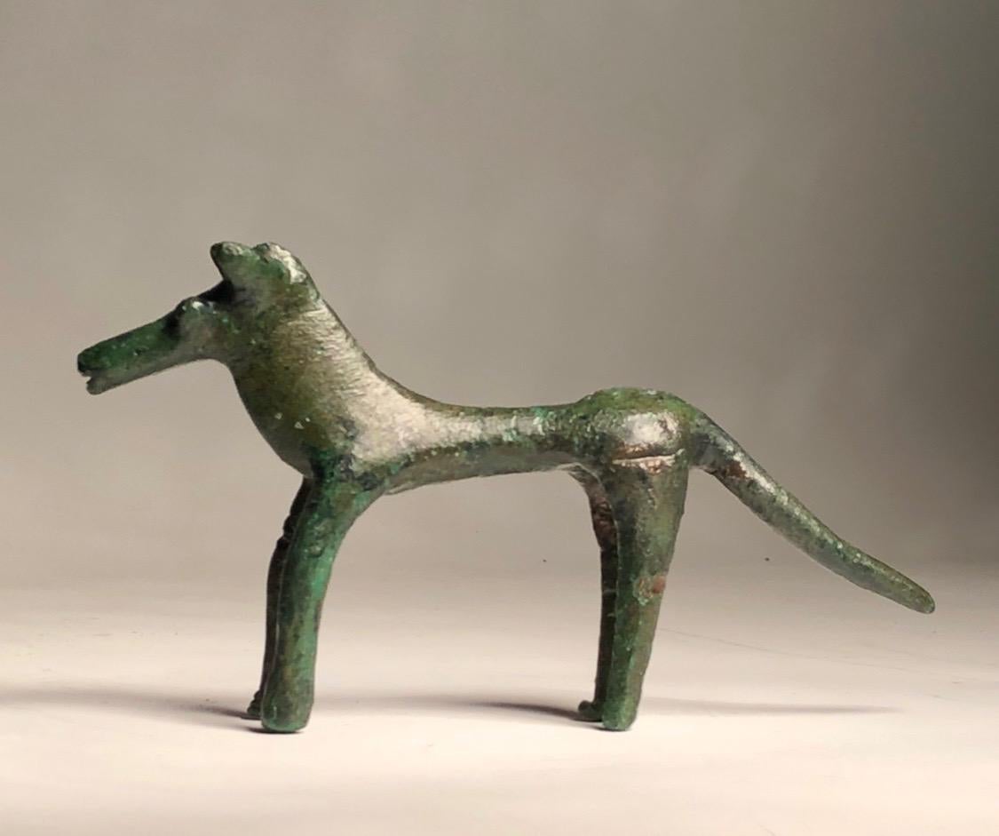 Bronze
Probably Attic, 8th century BC
Intact; with good dark green satin patina.
Measures: H 6.2 cm, L 11.2 cm

This is an elegant example of a bronze ancient Greek Geometric Period horse of Attic style. By Attic we understand the various