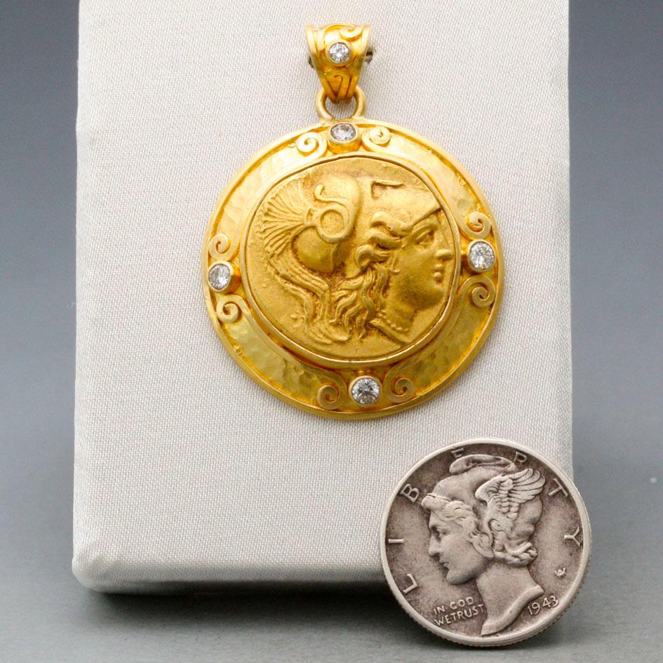 An authentic and verified Ancient Greek Gold Stater from 336-323 BC displaying Athena in a Corinthian helmet is set in a complementary Steven Battelle 22K pendant design accented by five 2mm VS1 diamonds.  This coin has been examined and certified