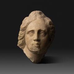 Ancient Greek Head of a young man, Eros or wounded Amazon