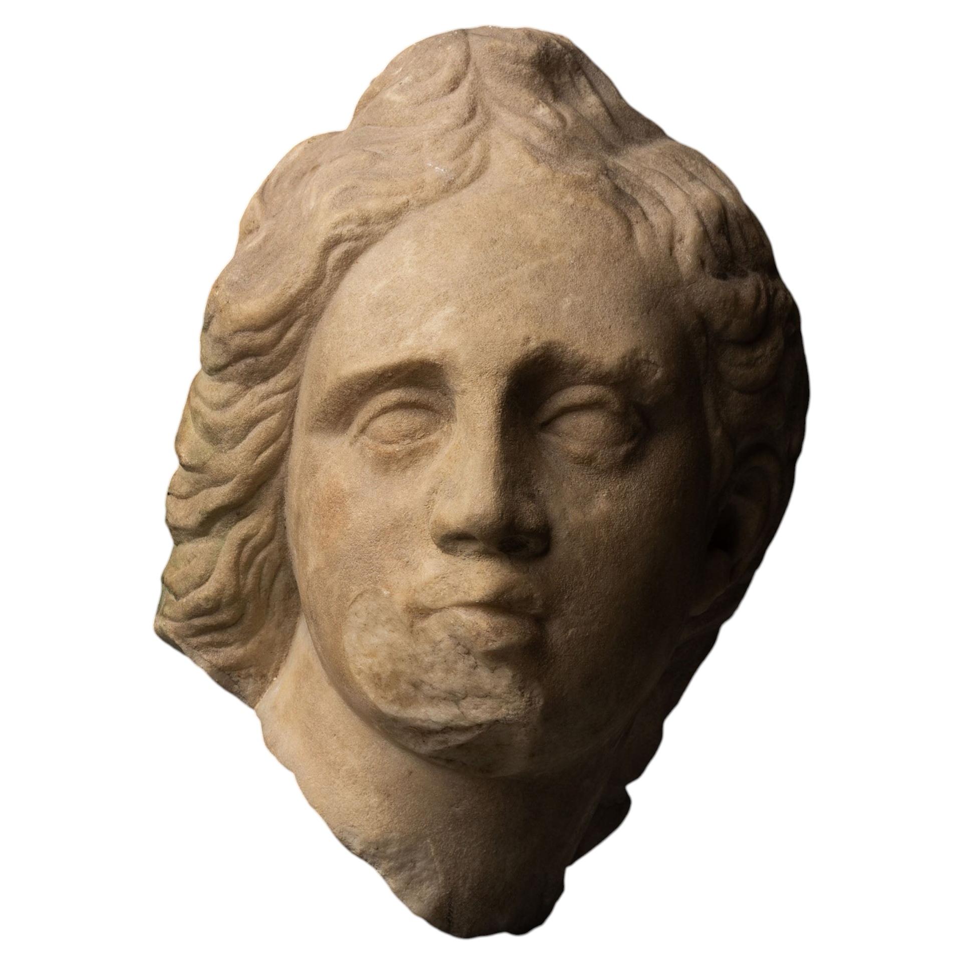 Ancient Greek Head of a young man, Eros or wounded Amazon