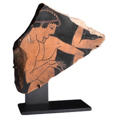 Fragmento de jarrón griego antiguo de figuras rojas con un atleta