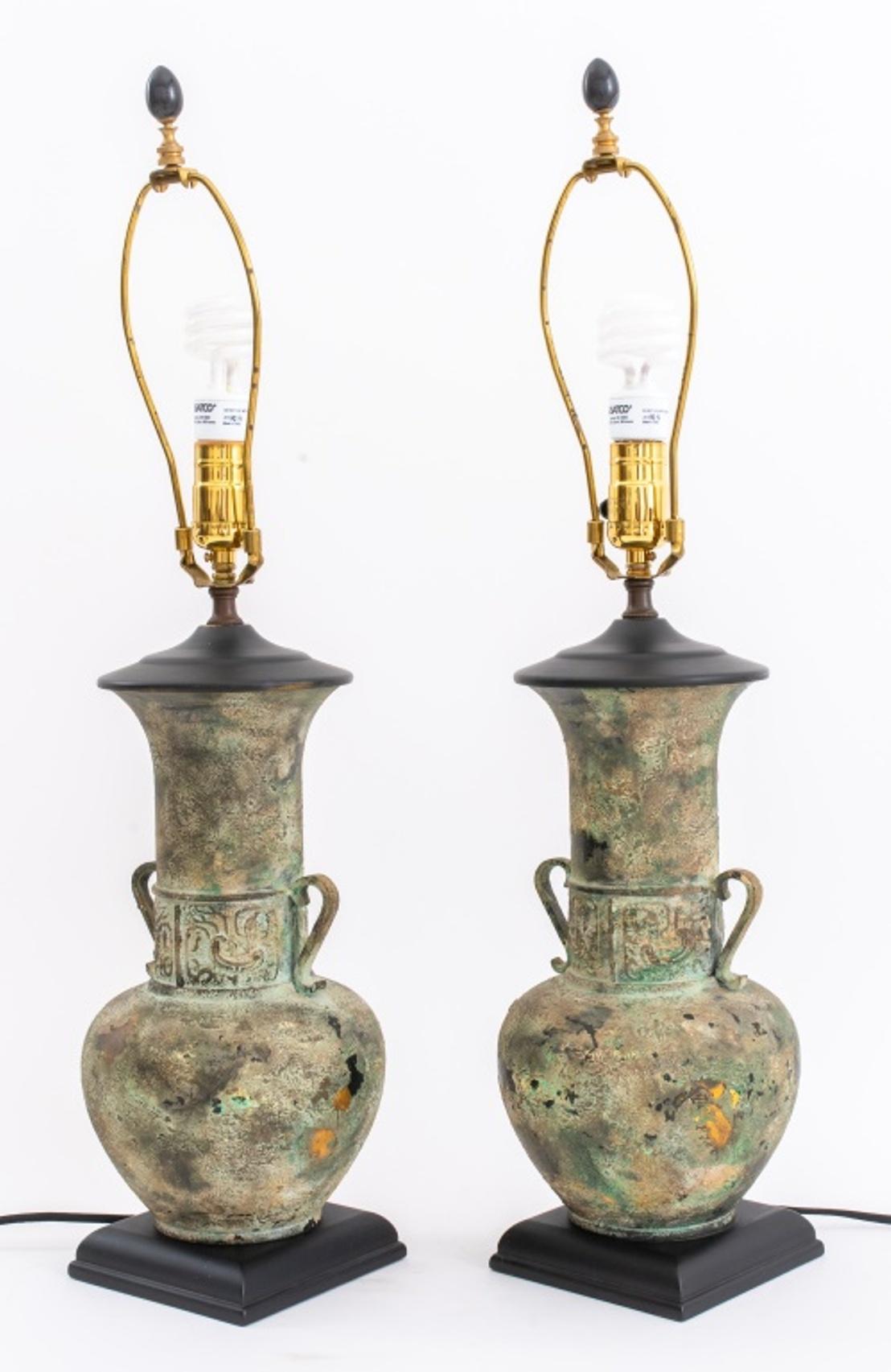 Pair of Ancient Greek revival patinated and chased brass amphora form table lamps with handles.

Dimensions: 28