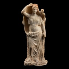 Ancient Greek Sculptural group of the goddess Aphrodite and her son Eros