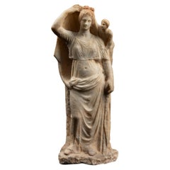Ancient Greek Sculptural group of the goddess Aphrodite and her son Eros