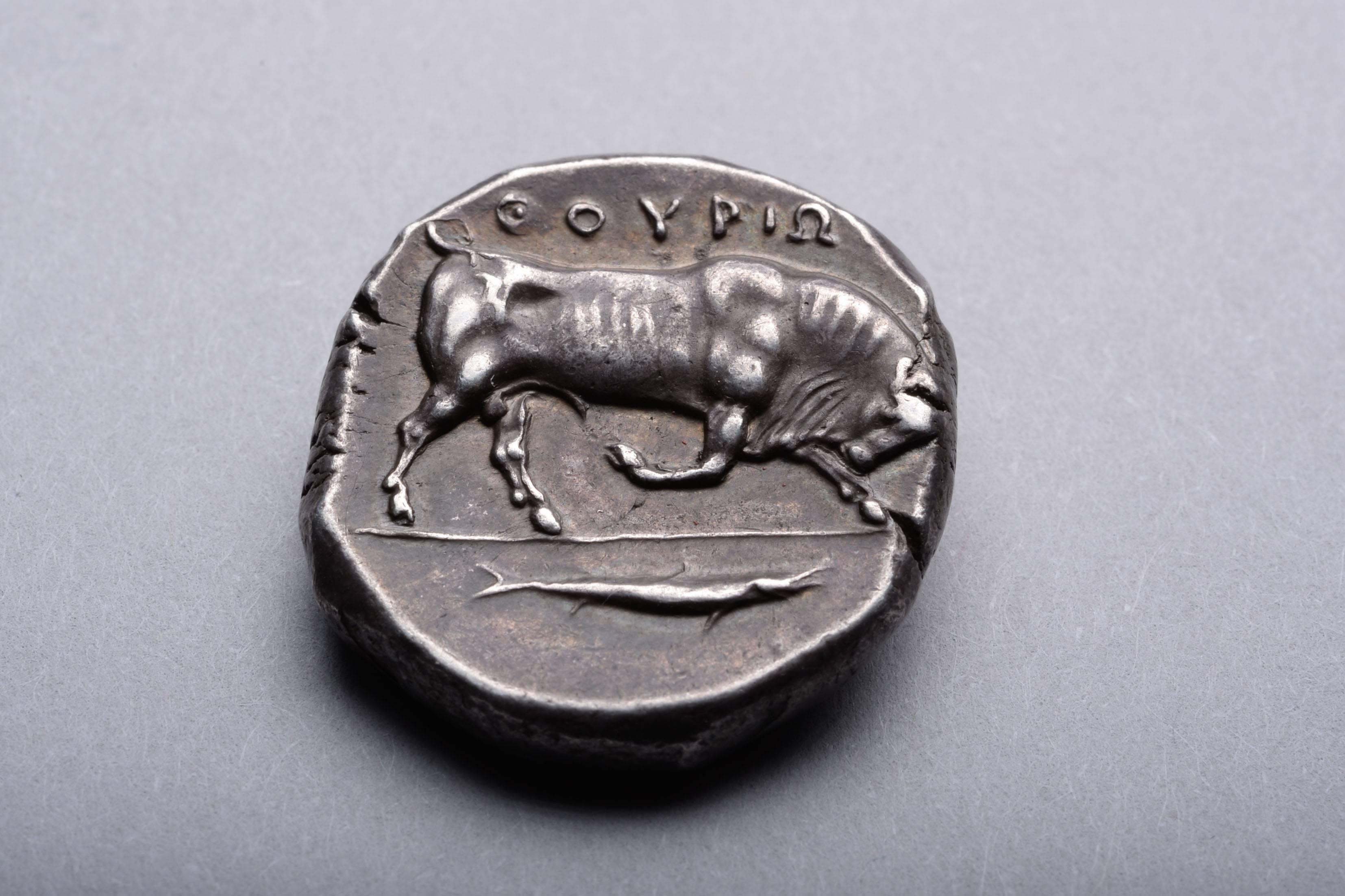 A silver distater from the collection of the British Museum, published in Sydney Noe's 1935 study. Minted in the Athenian colony of Thurium (Thourioi), South Italy, circa 400 - 350 BC.

The obverse with the head of Athena, wearing a crested