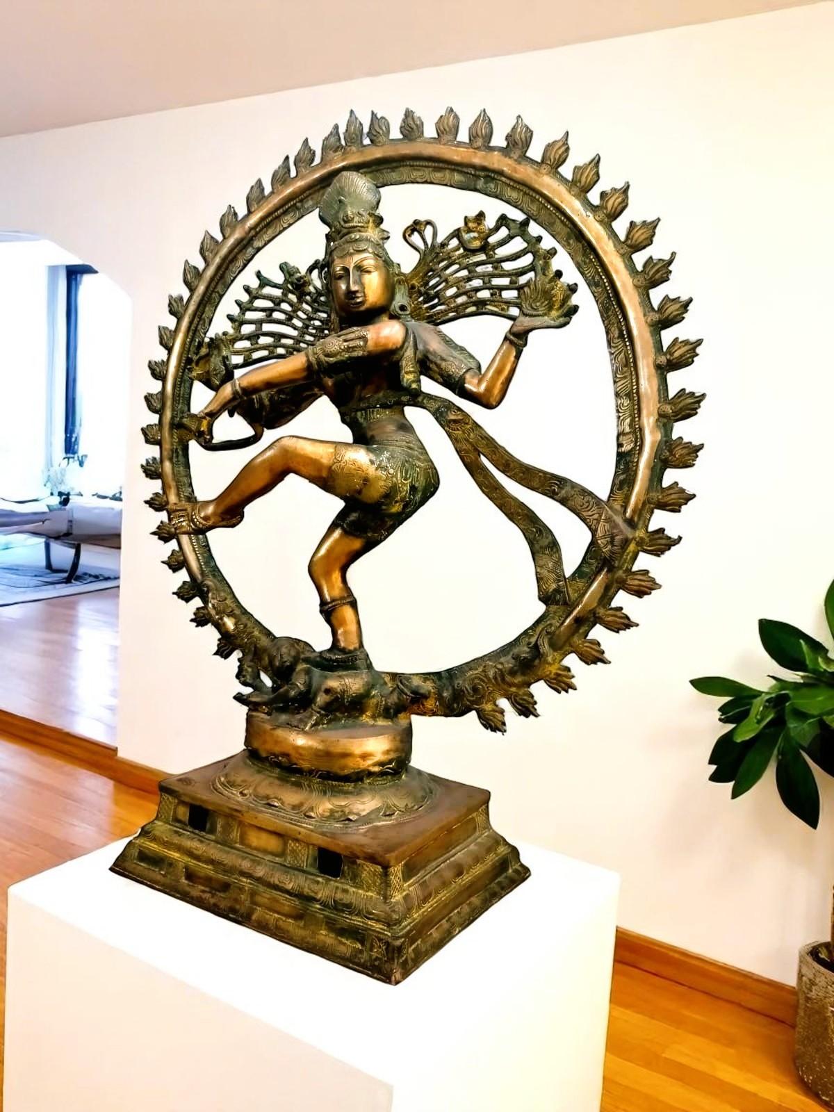 Ancient Indian solid brass sculpture - God Shiva dancing in the circle of fire, from the 1800s.

Dancing Shiva in the Circle of Fire
Brass statue of Shiva in the circle of fire
Ancient Indian brass statue, representing the deity Shiva dancing in the