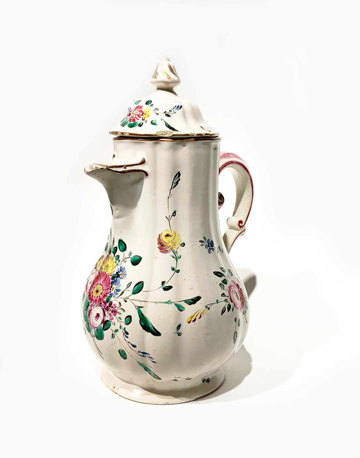 A coffee pot and two cups with saucers
Antonio Ferretti Manufacture 
Lodi, Circa 1765-1770 
Maiolica polychrome decorated “a piccolo fuoco” (third fire).
They measure:
coffee pot: 9.64 in height x 6.69 x 5.51 (24.5 cm x 17 x 14); ); 1.16 lb  (528
