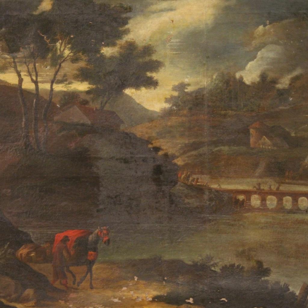 Ancient painting 18th century Italian. Opera first patina oil on canvas depicting landscape with wayfarer, horses, different buildings and animated bridge over the river. Door frame of nice size and pleasant furnishing for antiquarians and