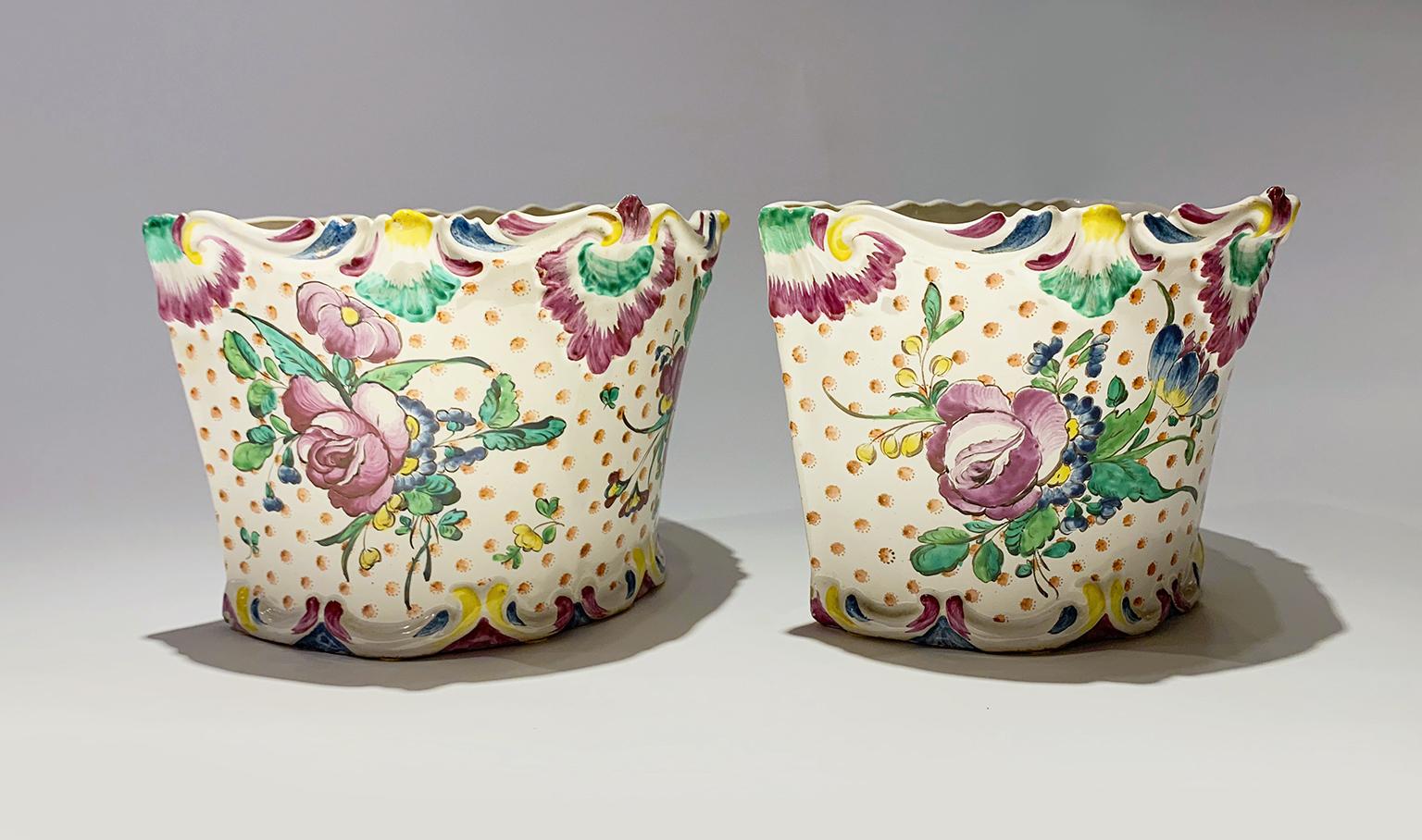 Maiolica flower pot “a mezzaluna” 
Pasquale Rubati Factory
Milan, 1770 Circa
They measure: height 6.2 in x 8.66 x 5.31 (15,8 cm x 22 x 13,5)
Weight: 1.86 lb (847 g) and 1.94 lb (881 g)
State of conservation: intact with slight chips.

A rare example