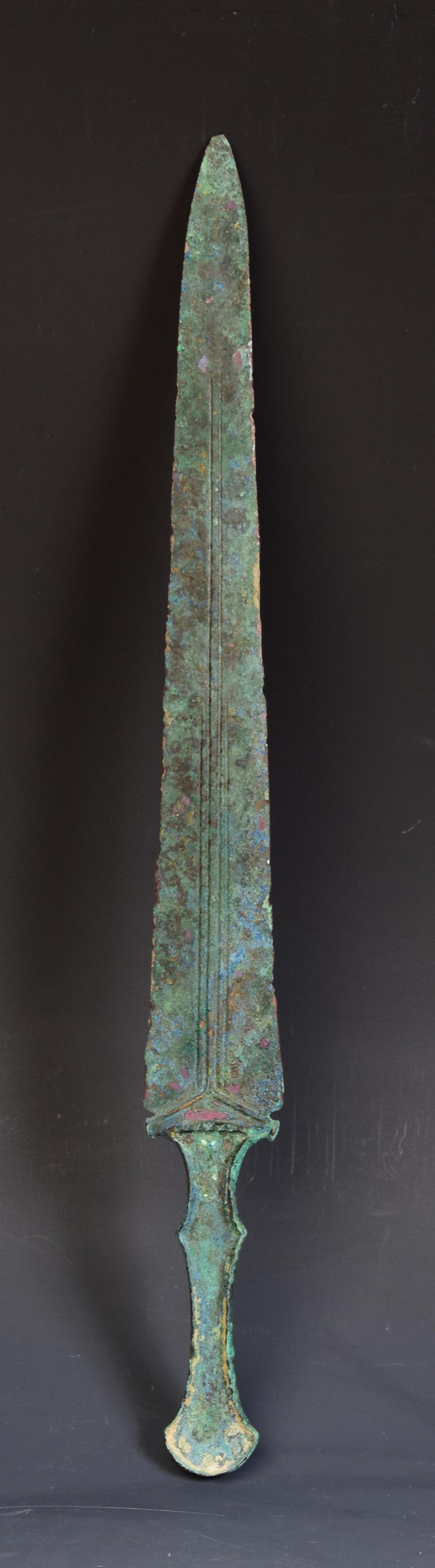 Ancient Luristan bronze short sword with magnificent blue-turquoise green patina.

Luristan bronze comes from the province of Lorestan, a region of nowadays Western Iran in the Zagros Mountains.  With its rich and long history, Luristan culture is