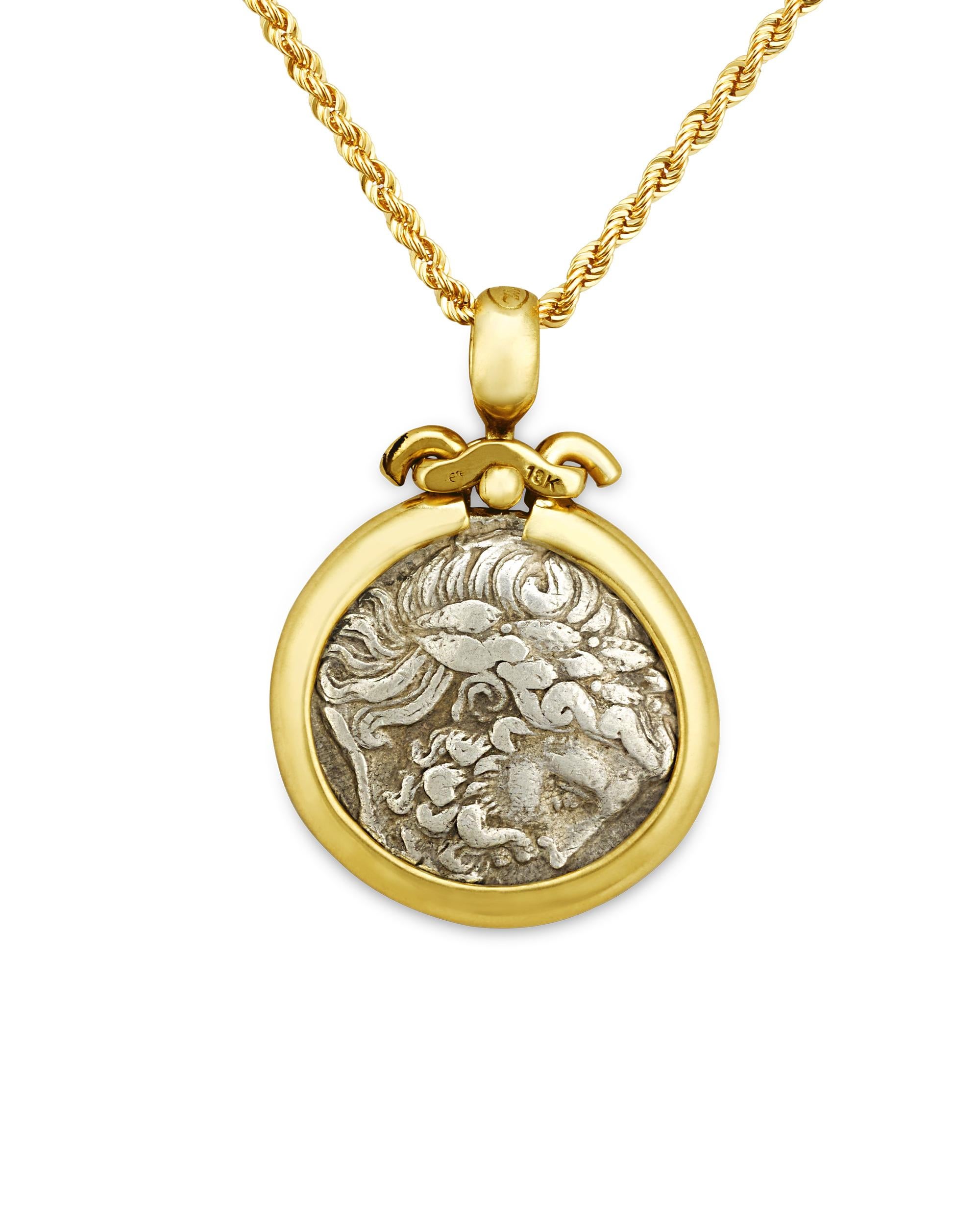 Over 2300 years old, the silver coin set in this elegant necklace dates to 348-342 BCE and celebrates King Philip II of Macedonia. From a later Amphipolis mint, the laureate head of Zeus features prominently on the front of the tetradrachm. On the