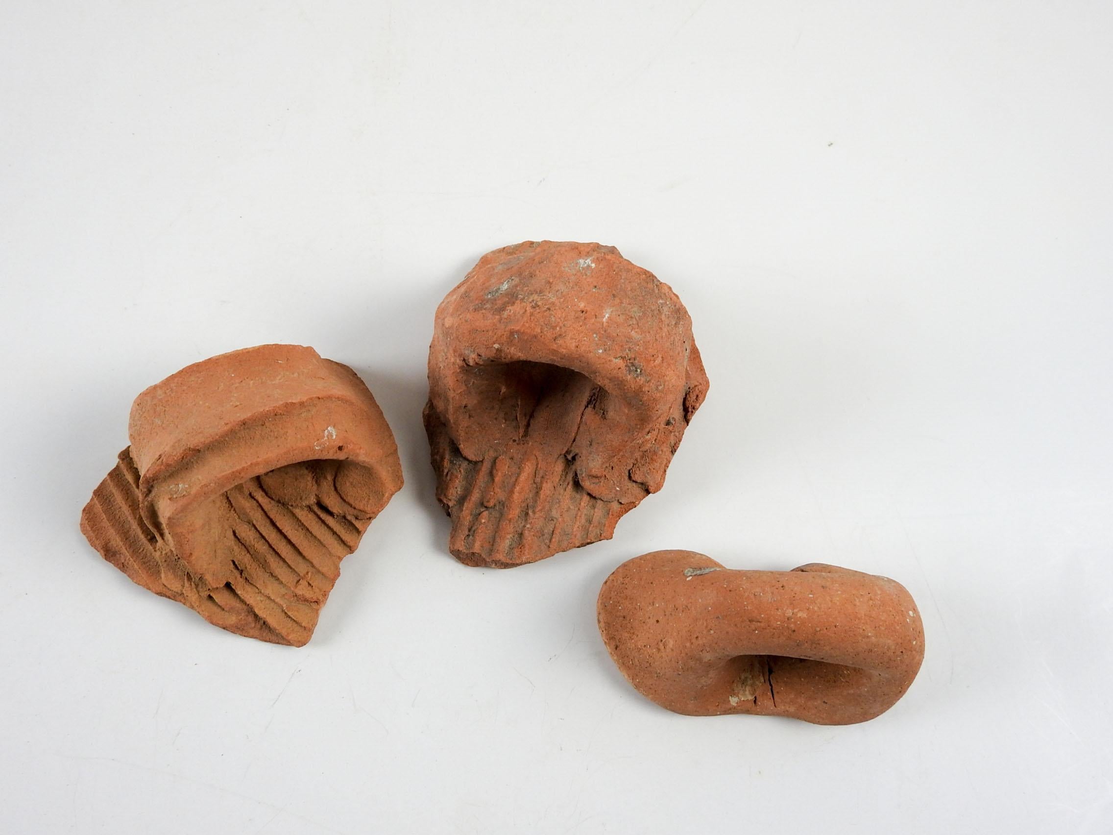 Group of 3 ancient Mediterranean terracotta pottery handle fragments . I have several sets of these, colors vary from brownish to reddish, size and overall wear will vary. Largest fragment is about 4