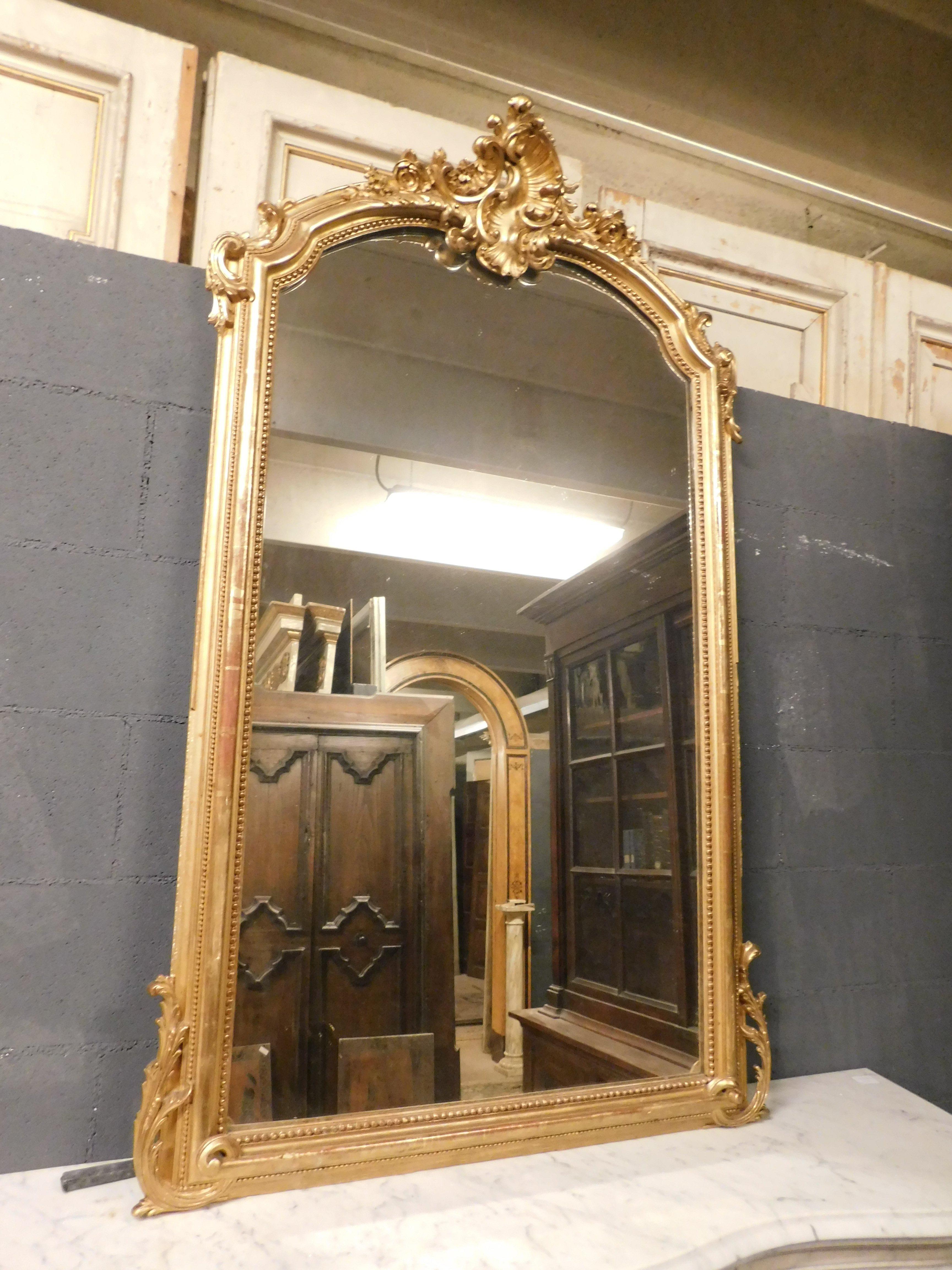 Italian Ancient Mirror in Gilded Wood with Richly Carved Frieze, 19th Century France For Sale