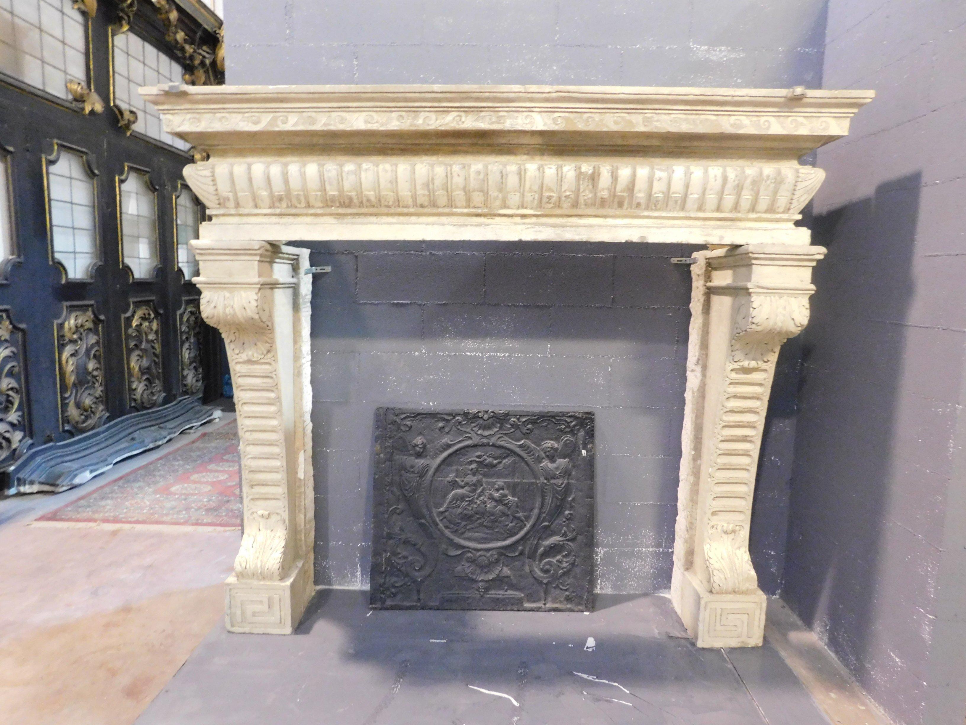 Very antique and big Italian stone fireplace mantel, imposing as it was done at the time, coming from a castle in Italy, excellent workmanship, all original and hand carved with molure and acanthus leaves as was done in the sixteenth