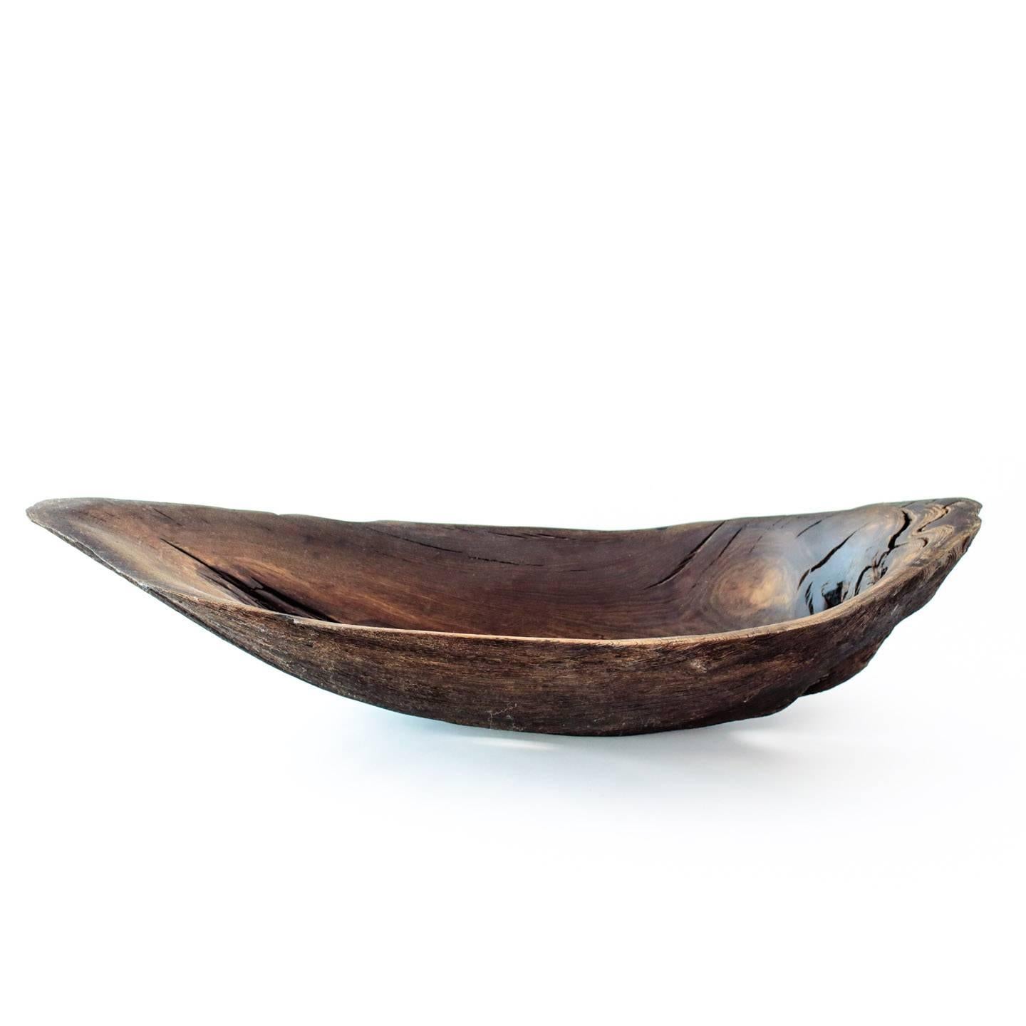 Bog-oak sculpted vessel by renowned British artist Adrian Swinstead.

Bog-oak is the timber from oak trees that have been buried in peat bogs and preserved from decay by the acidic and anaerobic bog conditions, sometimes for hundreds or even