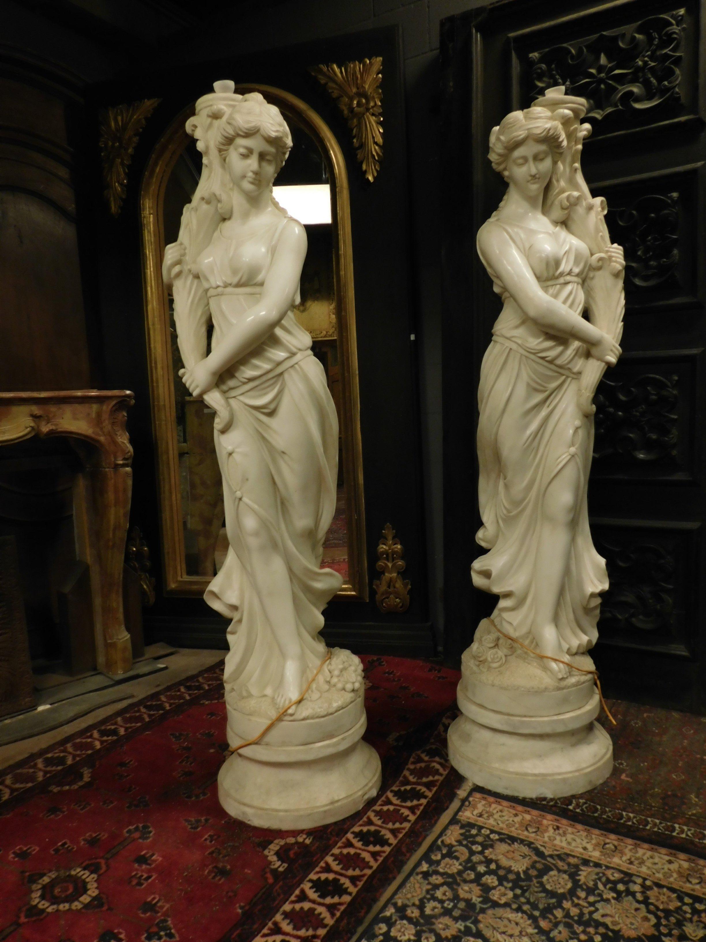 Ancient pair of statues (already with pipe and attachment for fountains) hand carved in white marble, full-length portraits of muses supporting the gush of water, made in the 1900s in Italy.
Precious marble, suitable for a luxury garden, or in a
