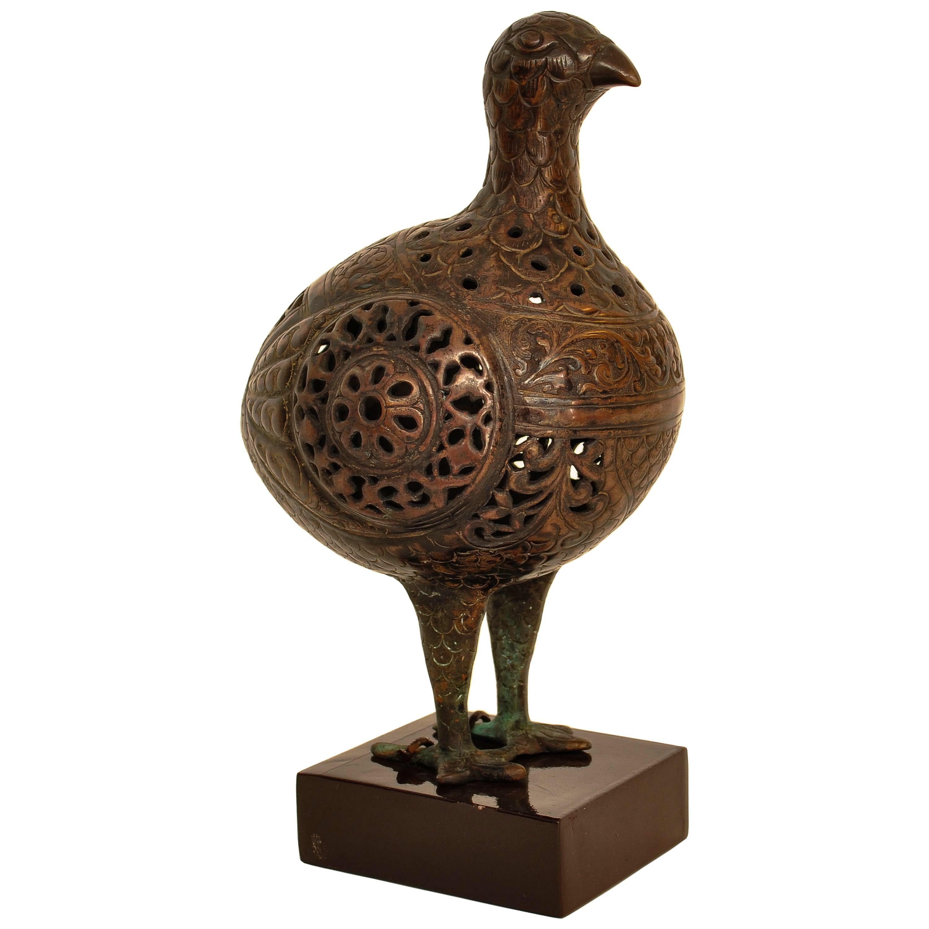 A fine and rare, ancient Islamic Seljuk period bronze bird statue, pomander, circa 1150, possibly Persia or Central Asia.
The bird is finely modeled and is engraved and has pierced work, such figures were used as pomanders or air freshners and were