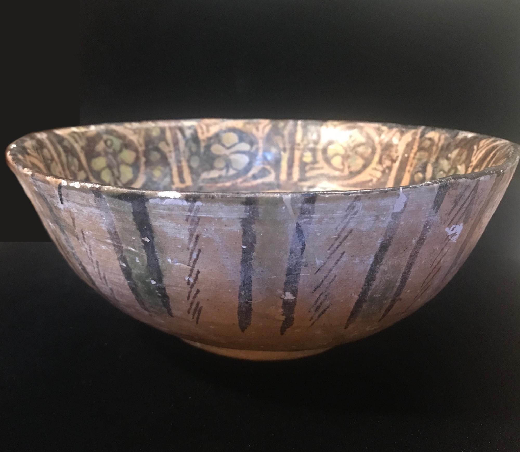 Ancient Persian Rare Kashan bowl 13th century Islamic Pottery Art.

This beautifully decorated and well cared for bowl is one of the few examples still in existence. It was made in Kashan, Persia in the 13th century, Seljuk- Atabeg period. Kashan
