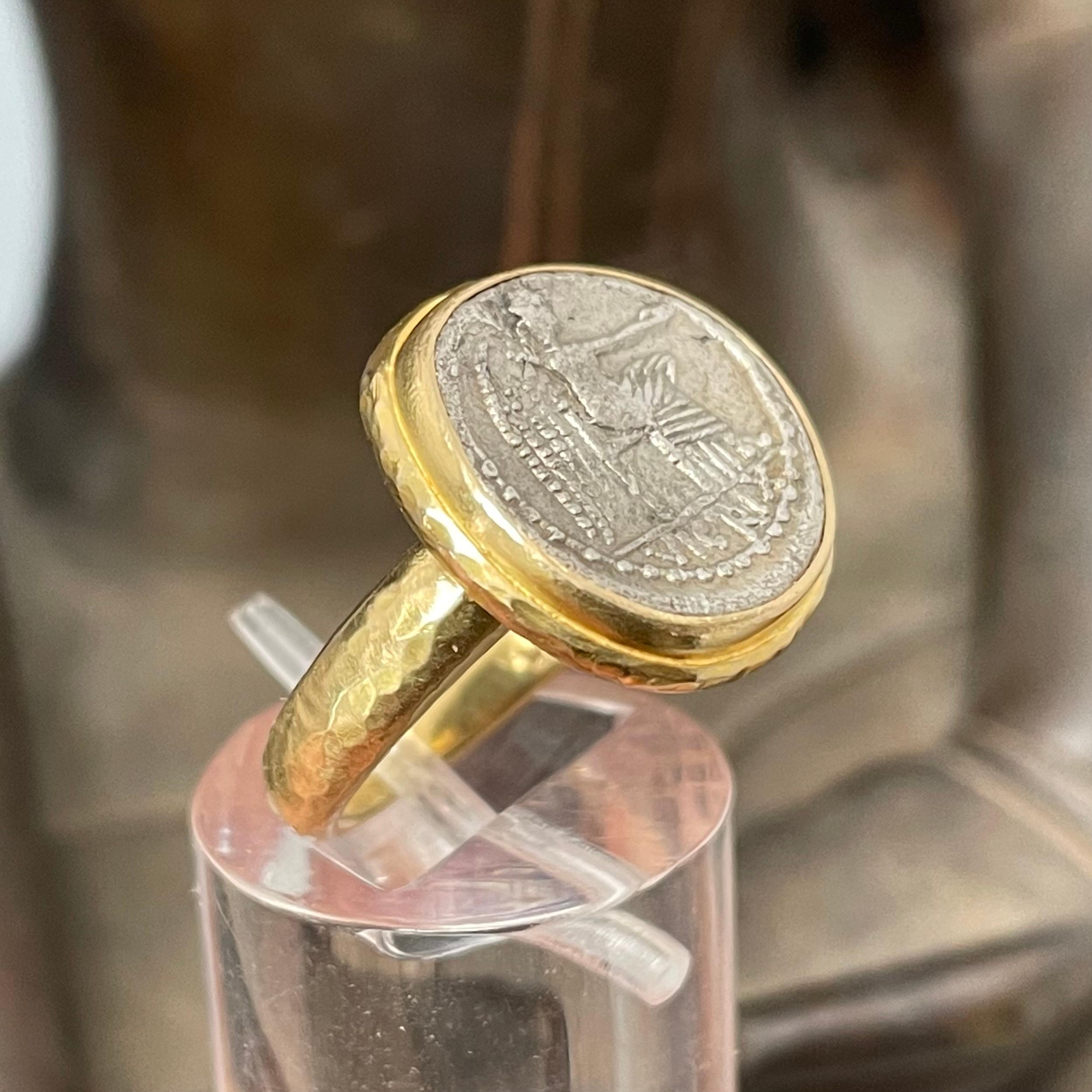 A beautiful authentic silver quinarius coin from the Roman Republic 89 BC, is set simply with a hammered bezel and hammered graduated shank in this ancient-inspired Steven Battelle ring design.  This coin depicts victory seated, holding a patera