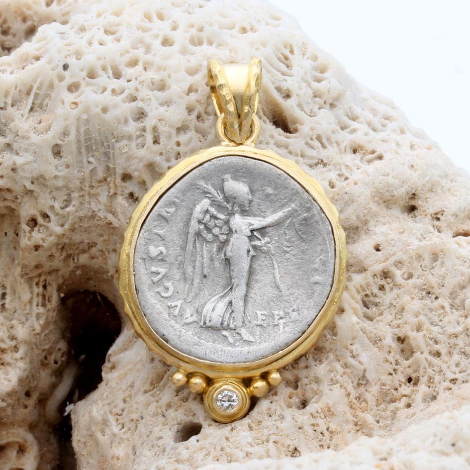 A classic image of the Roman winged goddess Victory adorns an authentic ancient silver 