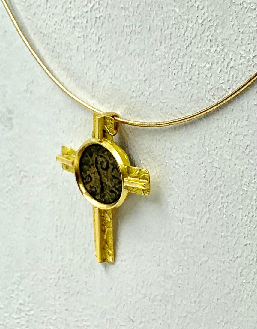 Historically significant, the coin in this gold crucifix dates to the year most experts agree was the time of trial and crucifixion of Jesus, 30 A.D. Pontius Pilate, the Roman Procurator under Emperor Tiberius, 26-36 A..D, designed these coins