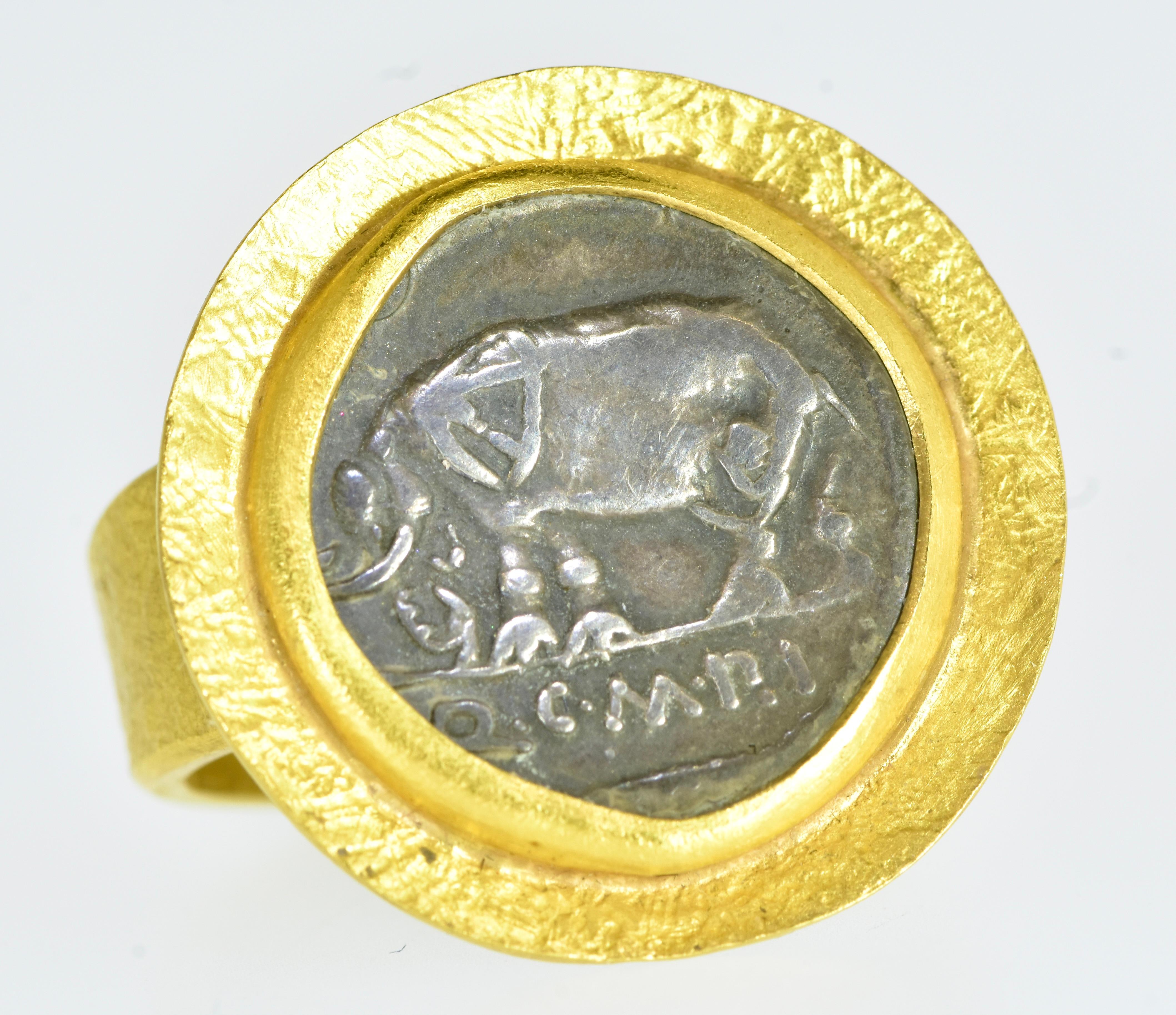 Ancient Denarius, Coin of Quintus Caecilius Metellus Pius, mounted in a 22K hand hammered, hand crafted large and stately gold ring by Fairchild & Co.  The authentic Roman Denarius,  approximately 17 mm., is in fine condition with  fine relief, of 