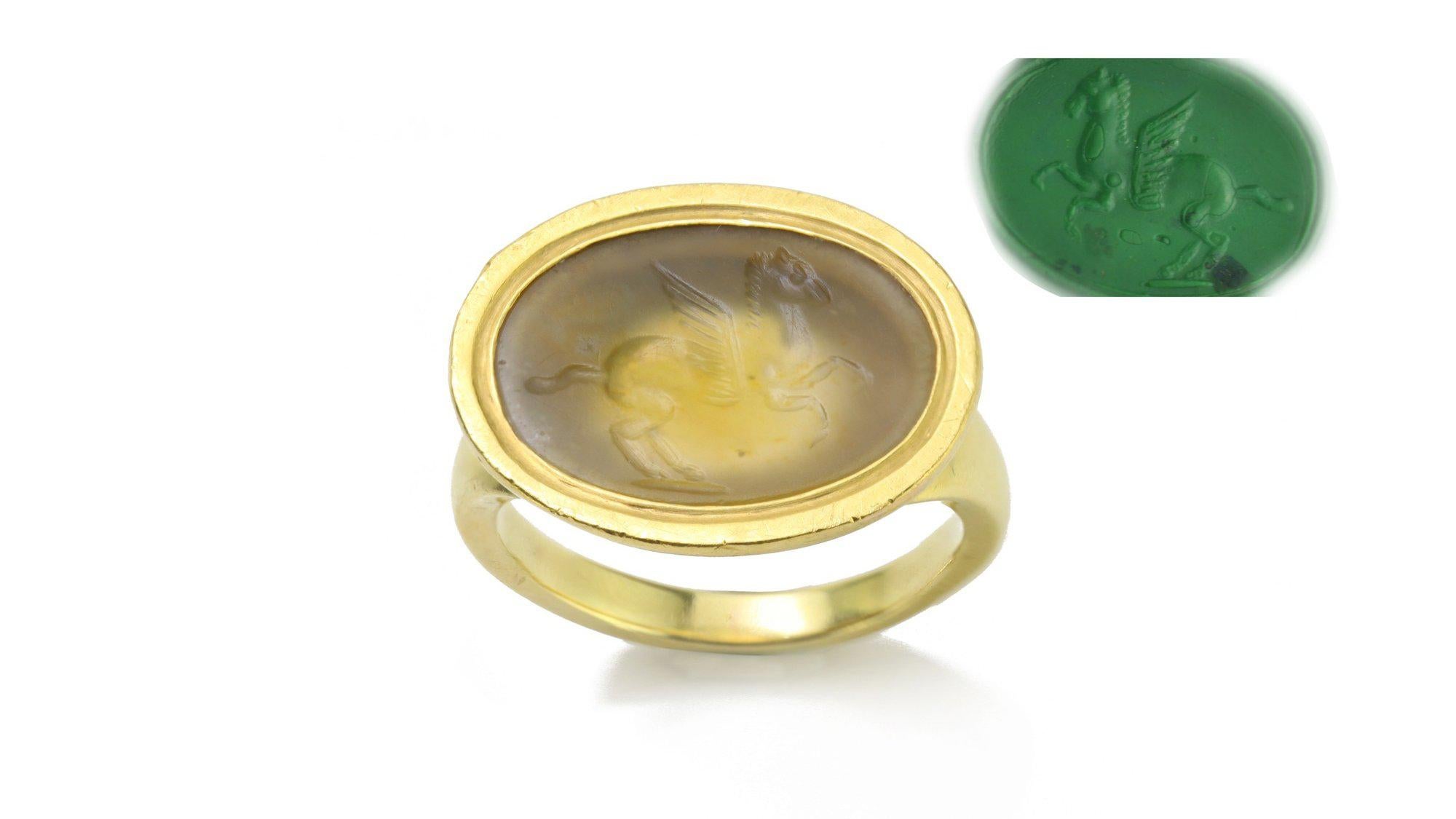 Ancient Roman agate intaglio of Pegasus in vintage high carat setting as a ring.
Intaglio made in Circa 200 BC - with shank added later Circa 1980's.
Tested positive for 18kt gold.

Pegasus is one of the best known mythological creatures in Greek