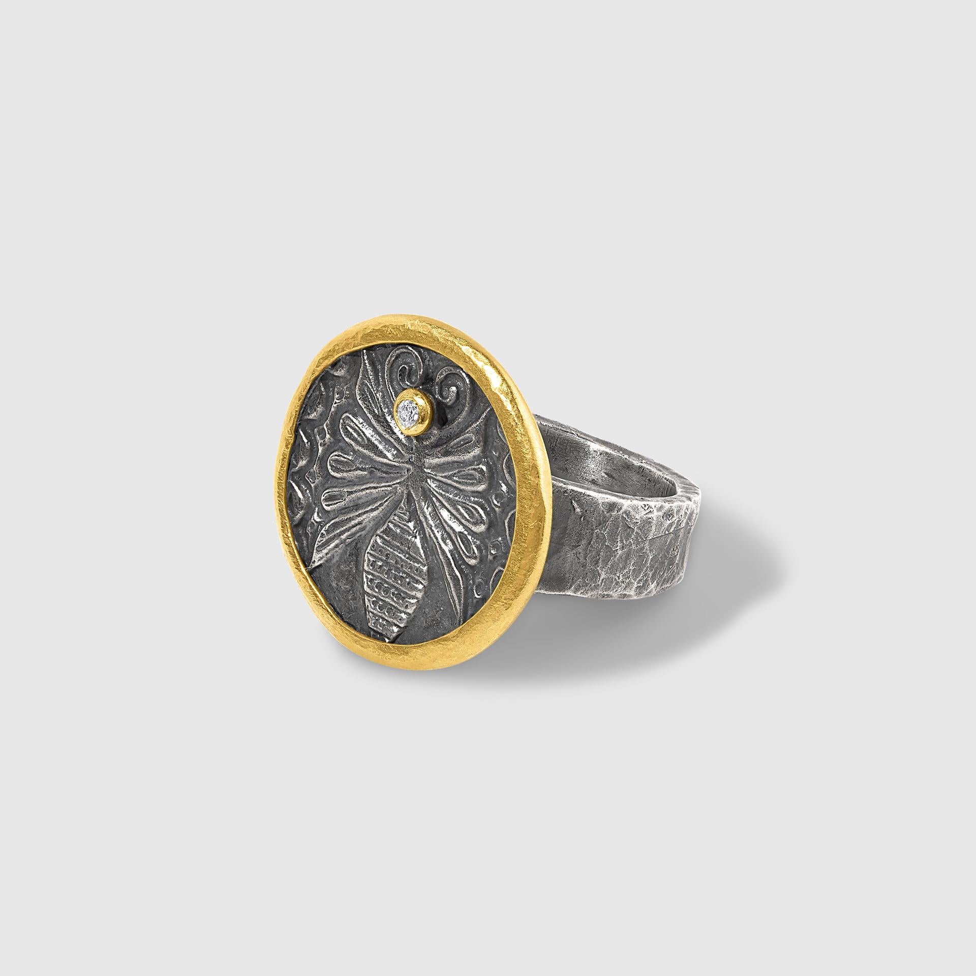 Ancient Roman Bee Coin Ring with Diamond, in 24kt Gold and Silver by Prehistoric Works of Istanbul, Turkey. Diamonds - 0.02cts, Size 6 1/2 US

The wearing of a bee emblem can symbolize a strong network of unconditional love and support. It is also
